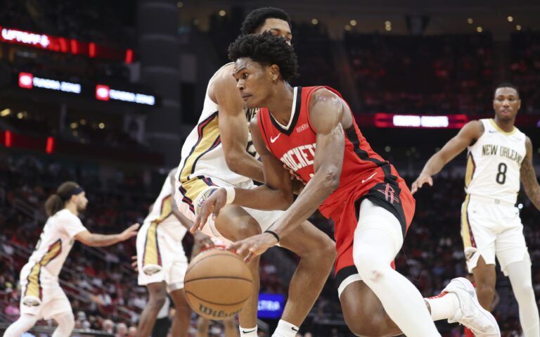 Houston Rockets forward Amen Thompson (1) dribbles the ball during the game against the New Orleans Pelicans at Toyota Center.