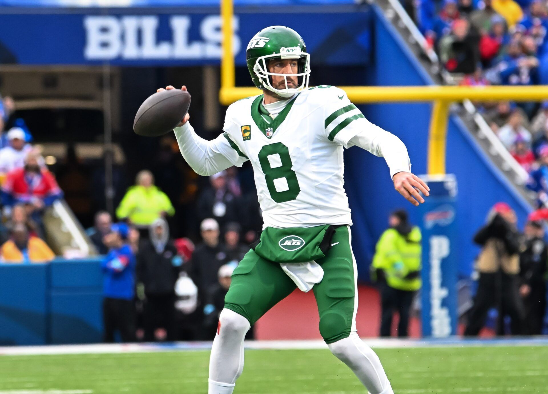 New York Jets quarterback Aaron Rodgers (8) throws a pass in the first quarter against the Buffalo Bills at Highmark Stadium.