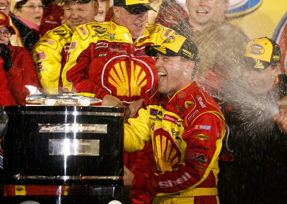 Kevin Harvick, driver of the No. 29 Shell Pennzoil Chevrolet, gets doused with champagne while celebrating in Victory Lane after winning the Daytona 500 at Daytona International Speedway in Daytona.