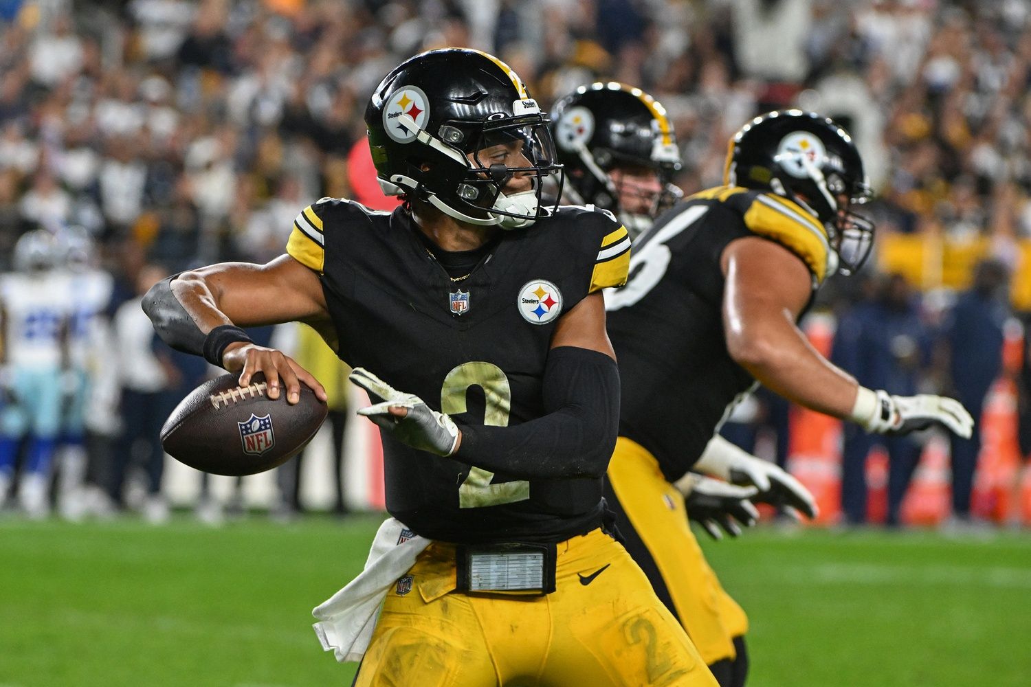 Pittsburgh Steelers quarterback Justin Fields (2) throws a pass against the Dallas Cowboys during the first quarter at Acrisure Stadium.