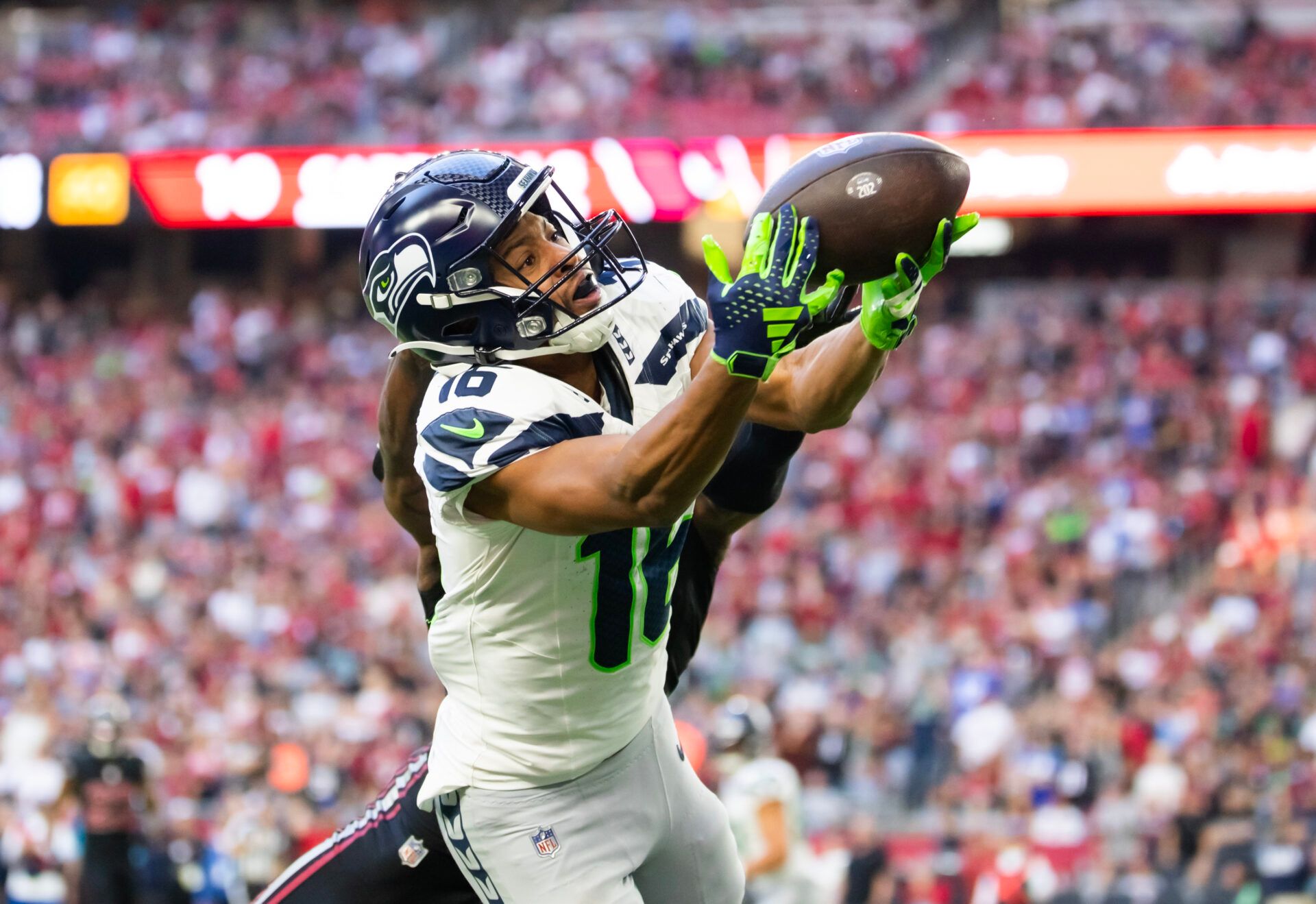 Dec 8, 2024; Glendale, Arizona, USA; Seattle Seahawks wide receiver Tyler Lockett (16) against the Arizona Cardinals at State Farm Stadium. Mandatory Credit: Mark J. Rebilas-Imagn Images