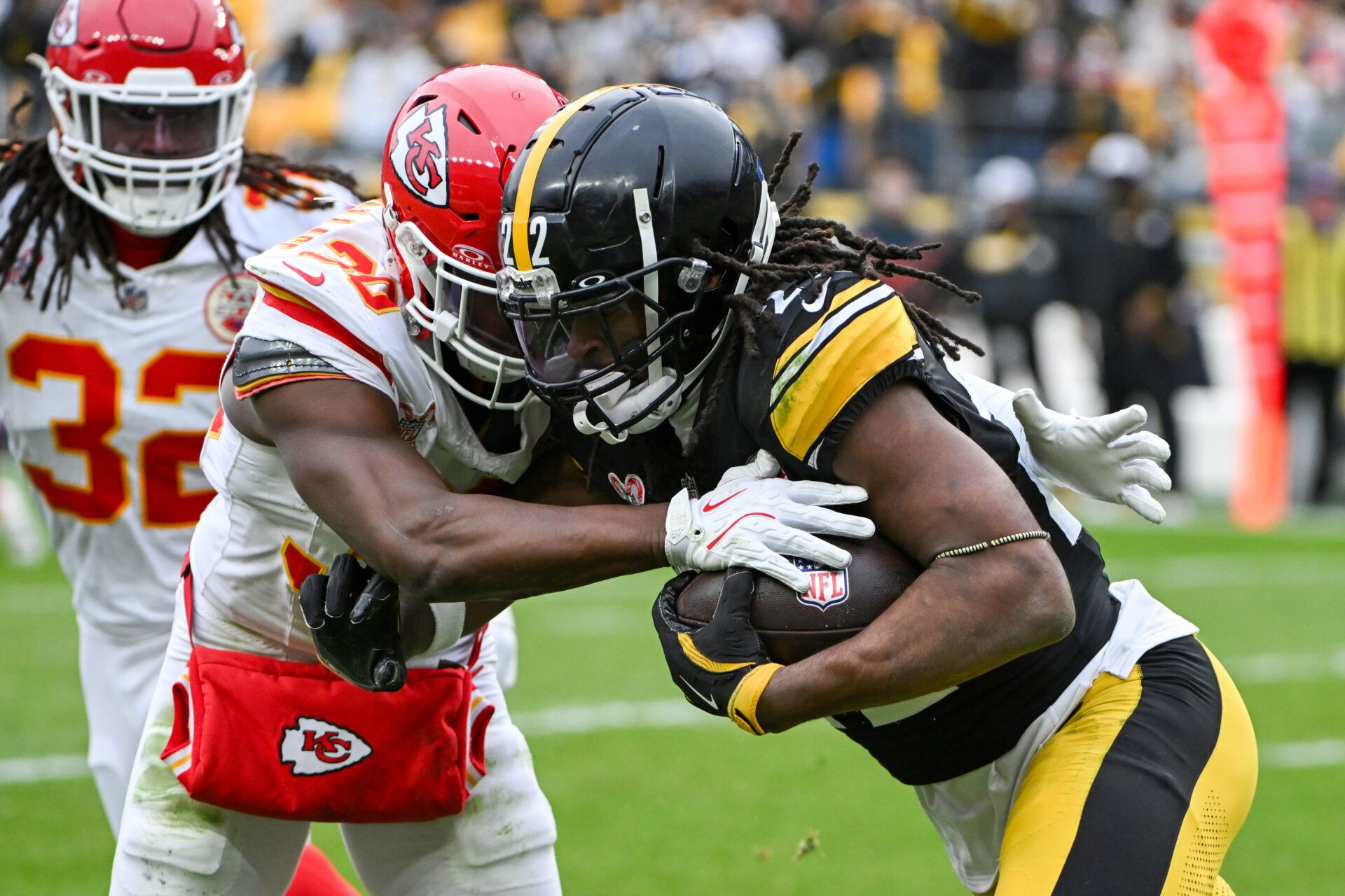 Dec 25, 2024; Pittsburgh, Pennsylvania, USA; Kansas City Chiefs cornerback Christian Roland-Wallace (30) tackles Pittsburgh Steelers running back Najee Harris (22) during the second half at Acrisure Stadium. Mandatory Credit: Barry Reeger-Imagn Images