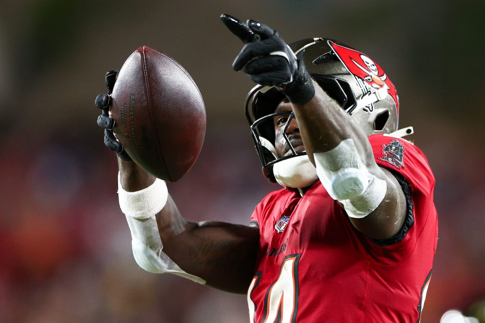 Oct 21, 2024; Tampa, Florida, USA; Tampa Bay Buccaneers wide receiver Chris Godwin (14) celebrates a first down against the Baltimore Ravens in the second quarter at Raymond James Stadium. Mandatory Credit: Nathan Ray Seebeck-Imagn Images