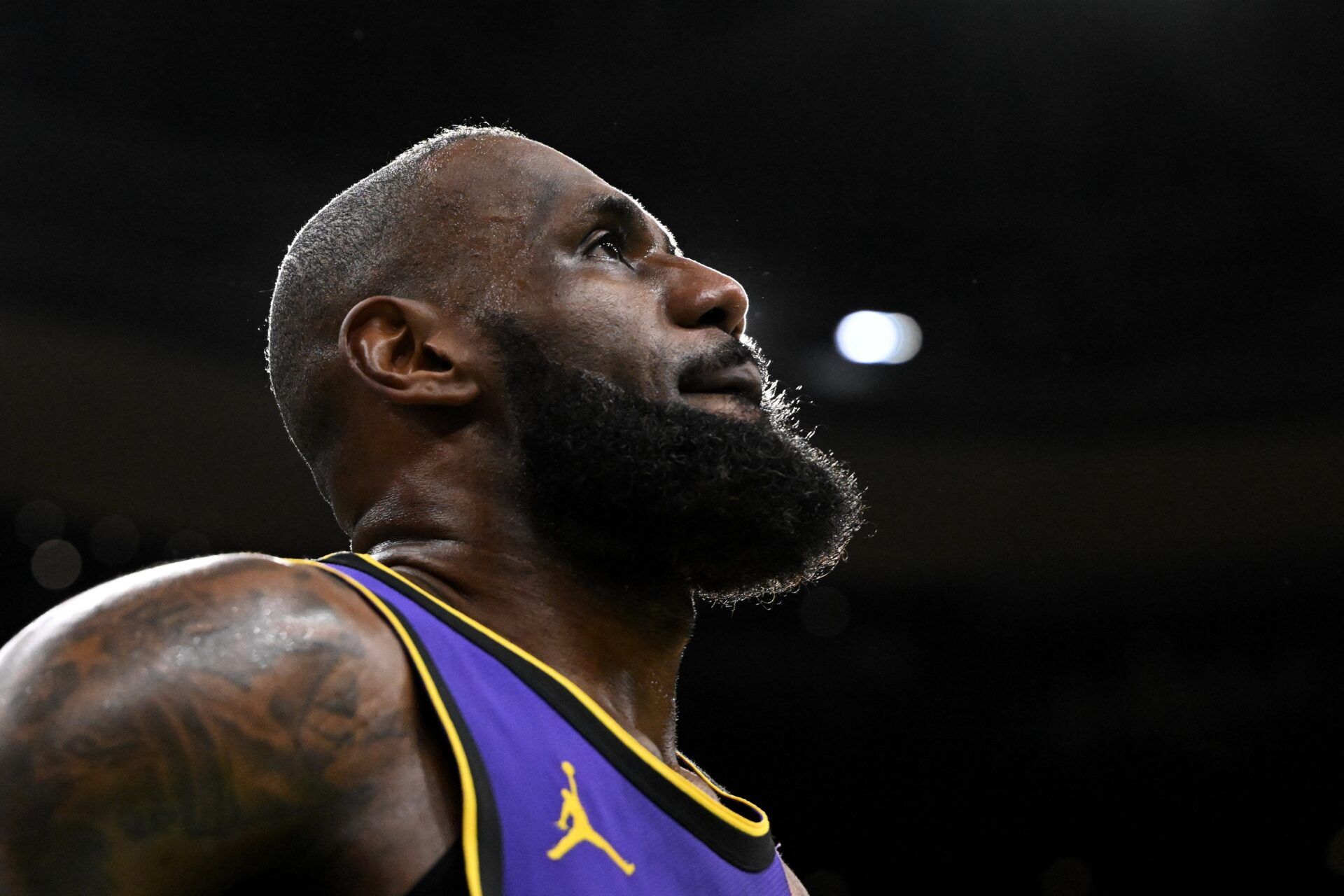 Los Angeles Lakers forward LeBron James (23) looks into the crowd during a timeout in the fourth quarter of a game against the Boston Celtics at the TD Garden.