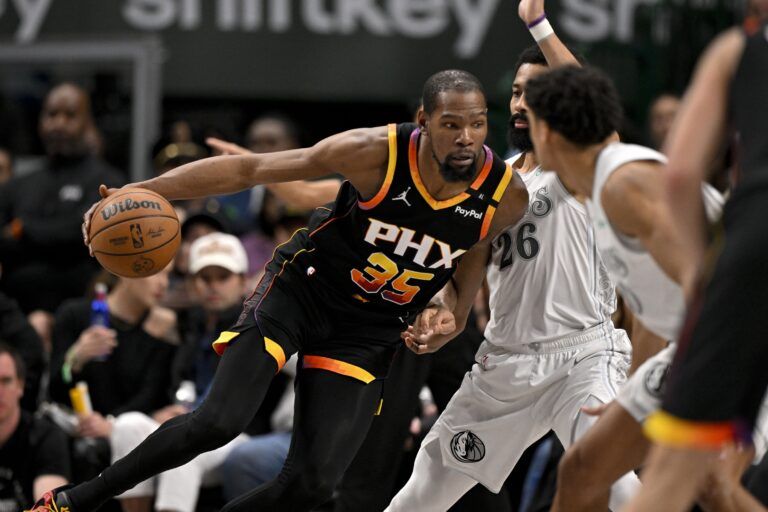Phoenix Suns forward Kevin Durant (35) moves to the basket against Dallas Mavericks guard Spencer Dinwiddie (26) during the second half at the American Airlines Center.