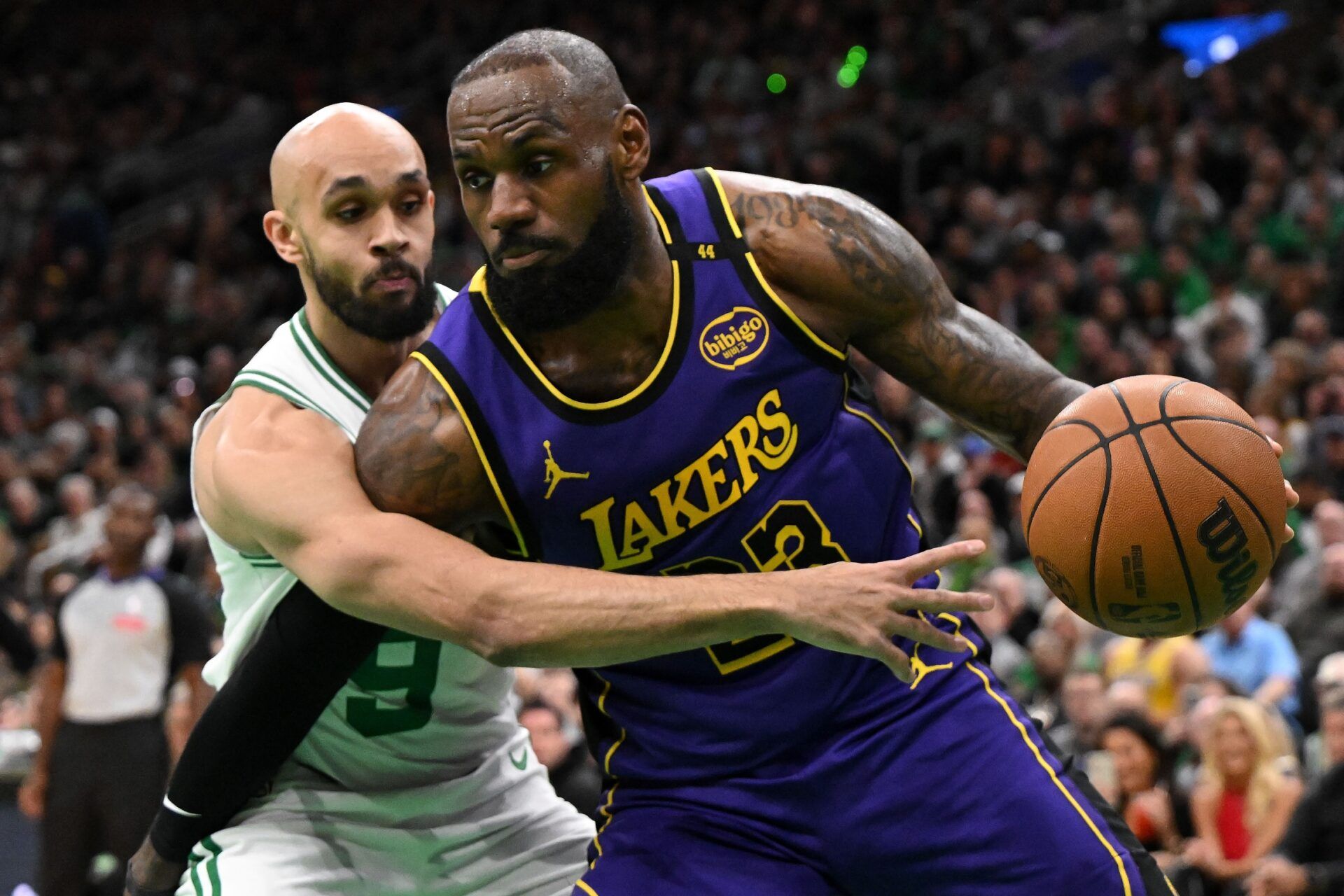 Los Angeles Lakers forward LeBron James (23) drives to the basket against Boston Celtics guard Derrick White (9) during the first quarter at the TD Garden.