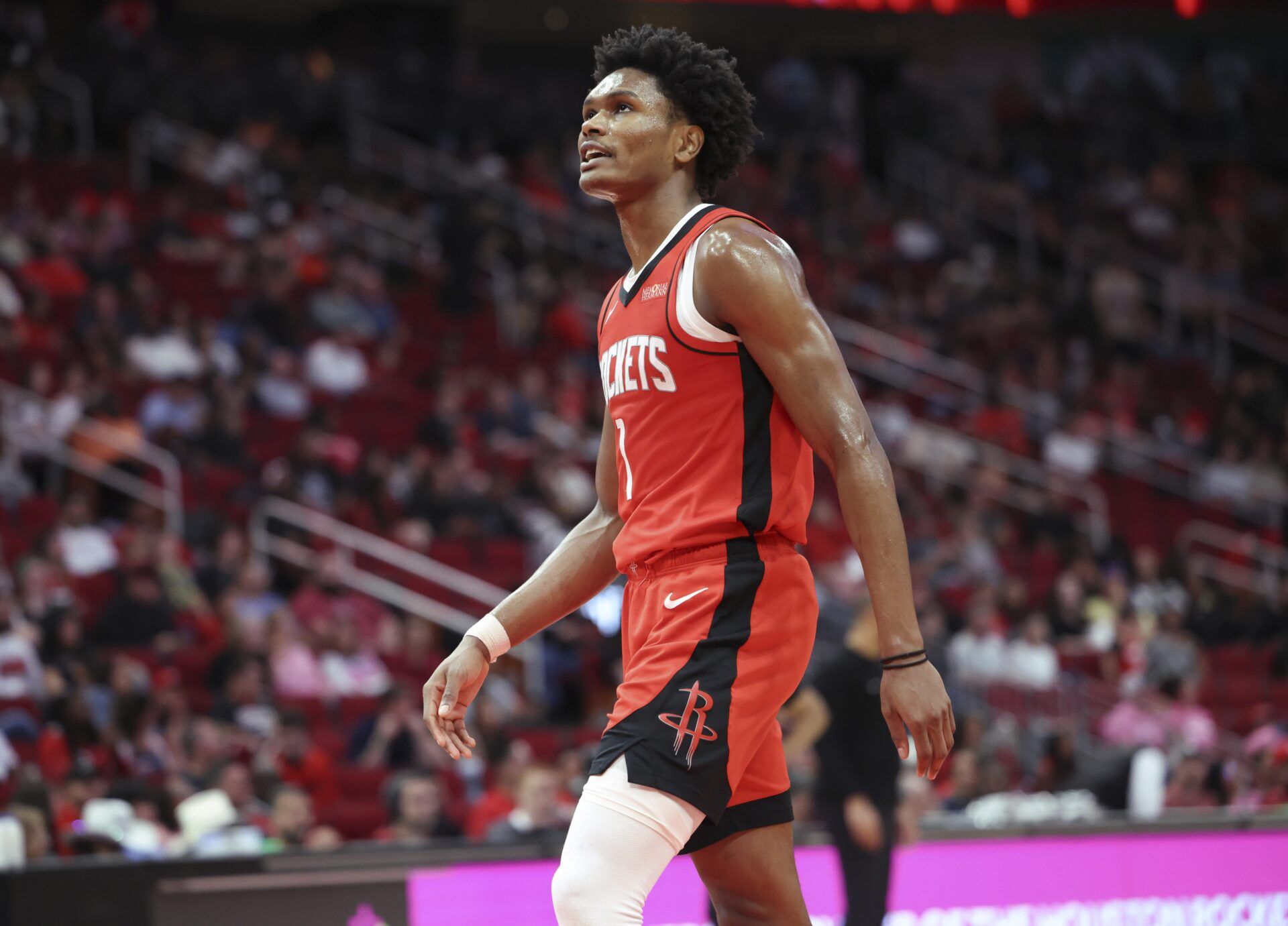 Houston Rockets forward Amen Thompson (1) walks off the court after suffering an apparent injury during the fourth quarter against the New Orleans Pelicans at Toyota Center.