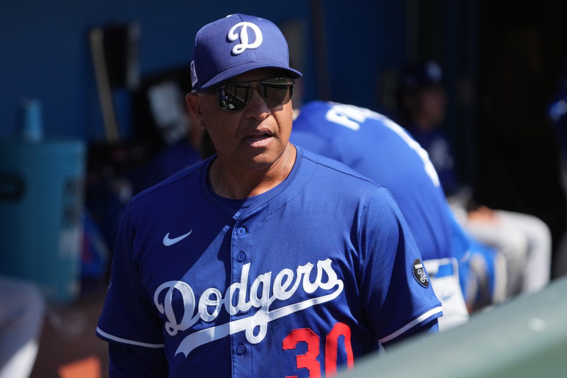 Los Angeles Dodgers manager Dave Roberts (30) gets ready against the Chicago White Sox before a game at Camelback Ranch-Glendale.