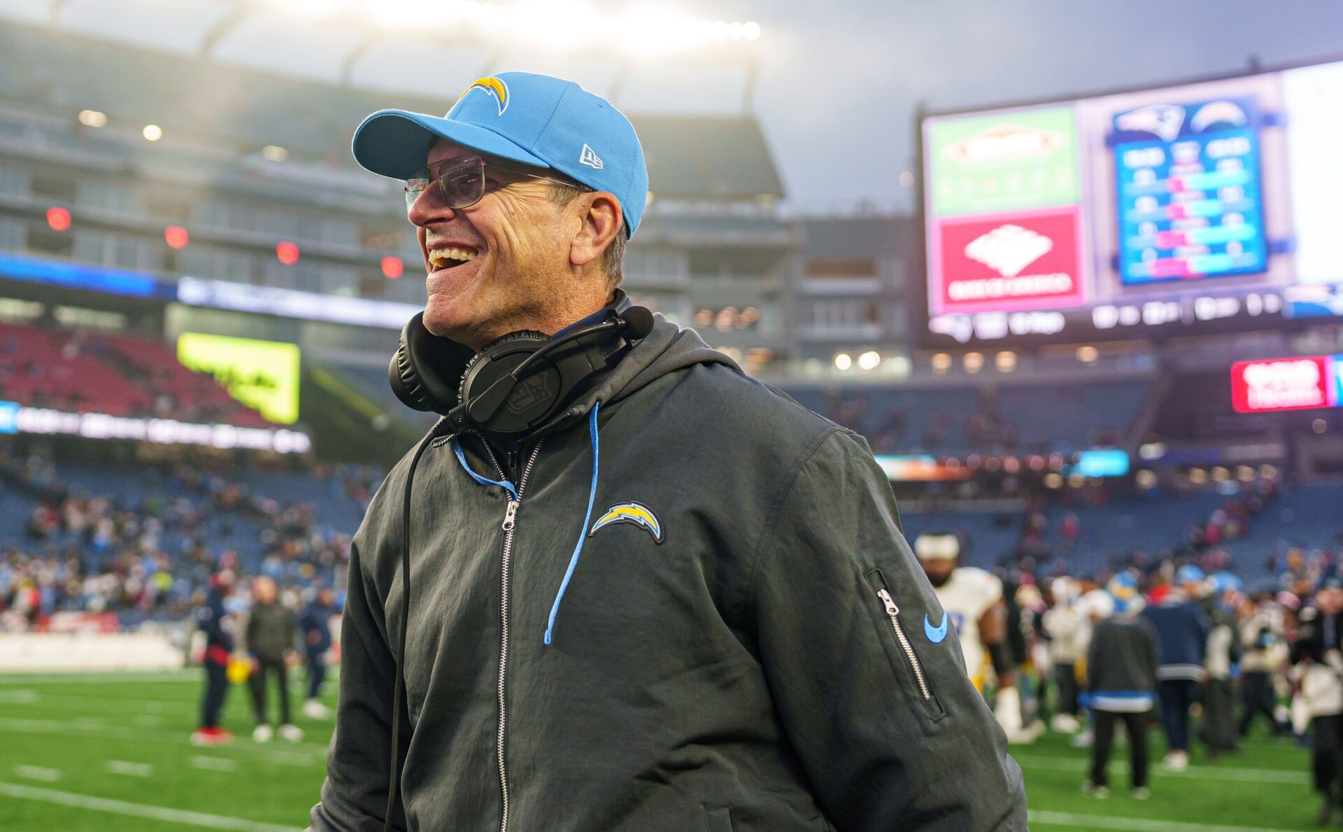 Los Angeles Chargers head coach Jim Harbaugh reacts after defeating the New England Patriots at Gillette Stadium.