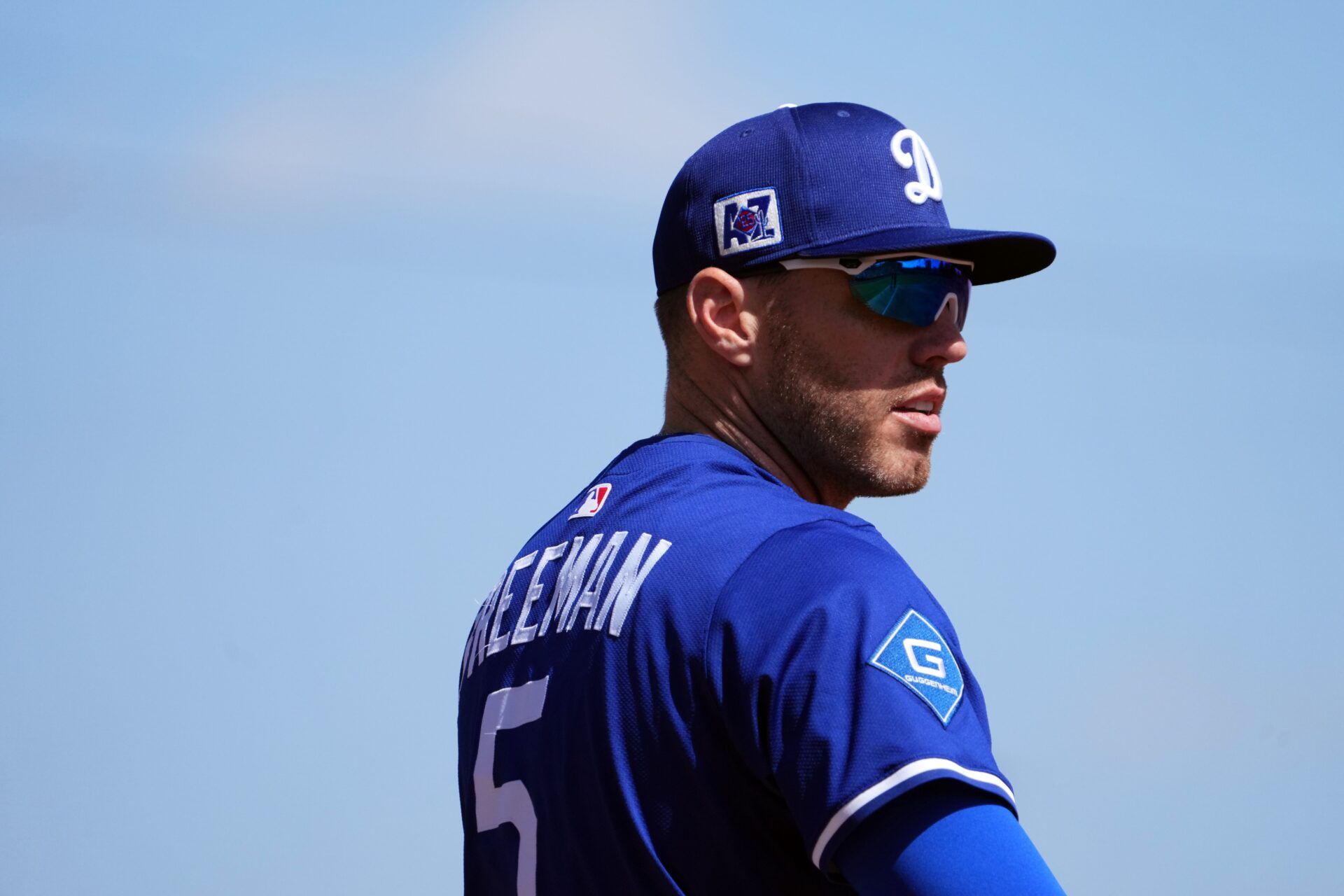 Los Angeles Dodgers first base Freddie Freeman (5) looks on against the Texas Rangers during the first inning at Camelback Ranch-Glendale.