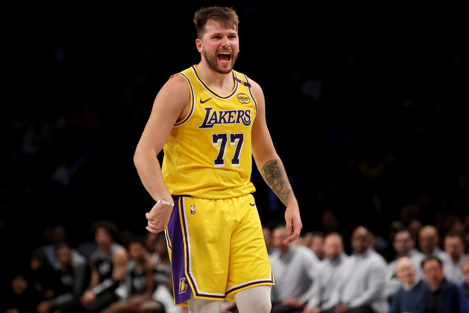 Los Angeles Lakers guard Luka Doncic (77) reacts after a three point shot against the Brooklyn Nets during the second quarter at Barclays Center.