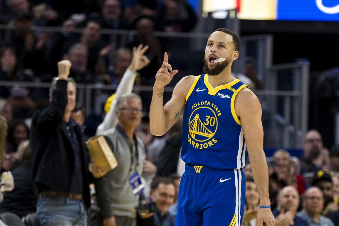 Golden State Warriors guard Stephen Curry (30) reacts after hitting a three-point shot against the Portland Trail Blazers during the third quarter at Chase Center.