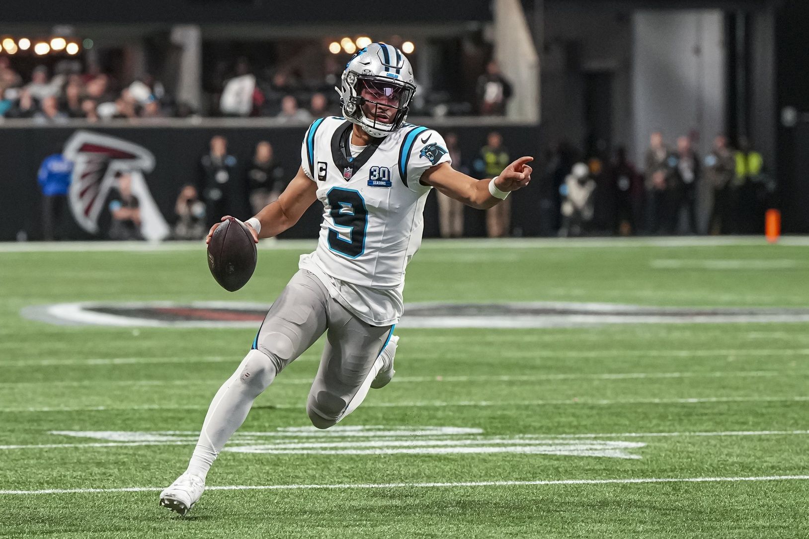Carolina Panthers quarterback Bryce Young (9) runs for a touchdown against the Atlanta Falcons during the second half at Mercedes-Benz Stadium.