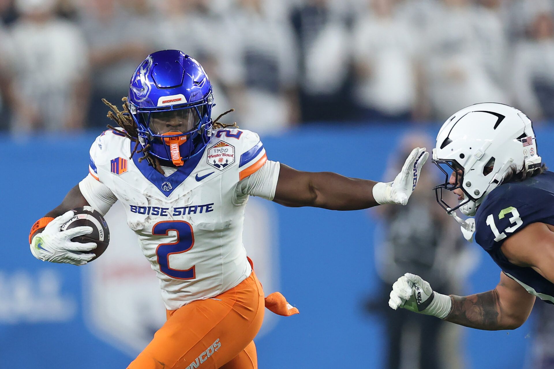 GLENDALE, ARIZONA - DECEMBER 31: Ashton Jeanty #2 of the Boise State Broncos runs the ball against Tony Rojas #13 of the Penn State Nittany Lions during the first half in the 2024 Vrbo Fiesta Bowl at State Farm Stadium on December 31, 2024 in Glendale, Arizona. (Photo by Christian Petersen/Getty Images)