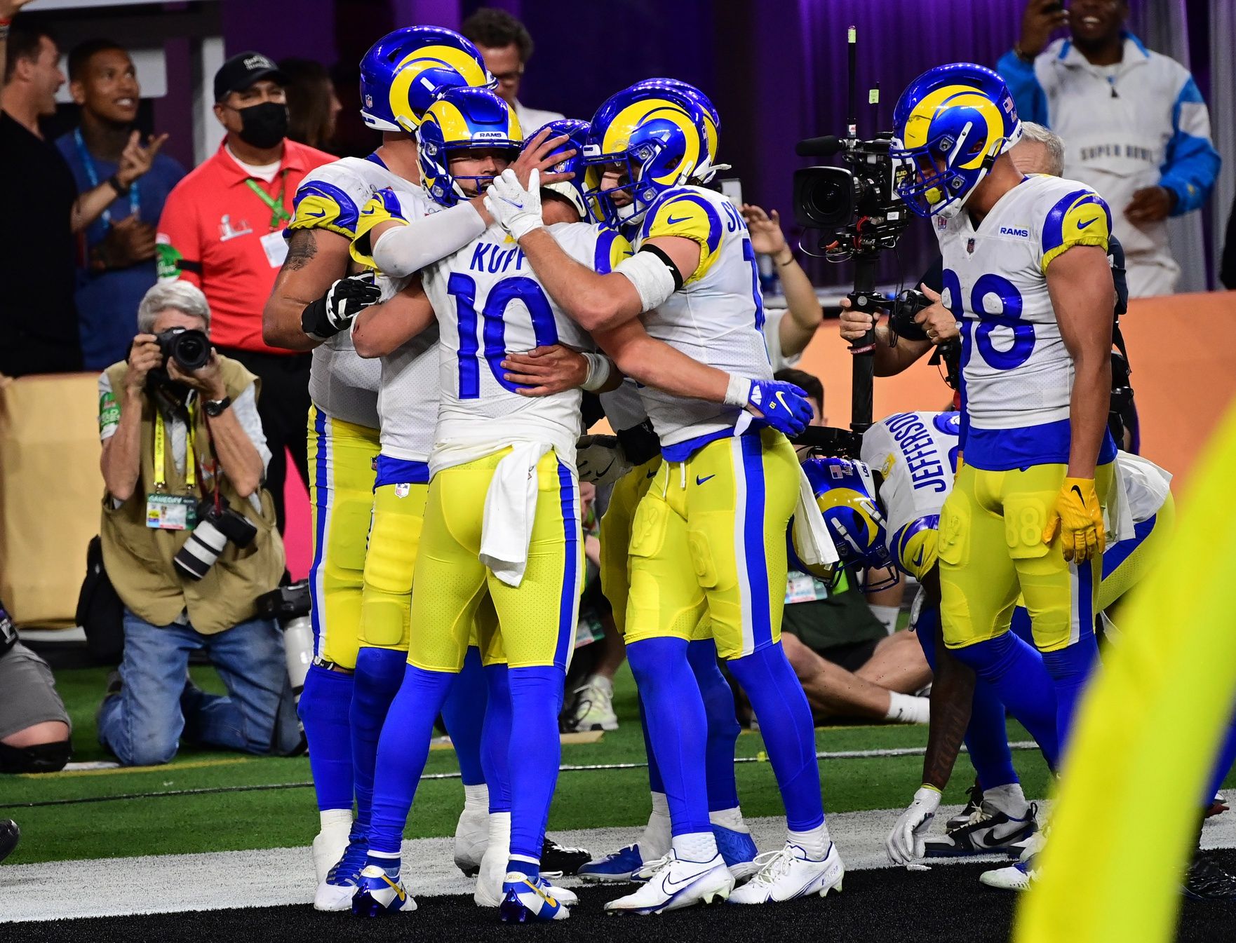 Los Angeles Rams quarterback Matthew Stafford (9) celebrates with receiver Cooper Kupp (10) after scoring a touchdown in the fourth quarter against the Cincinnati Bengals in Super Bowl LVI at SoFi Stadium.