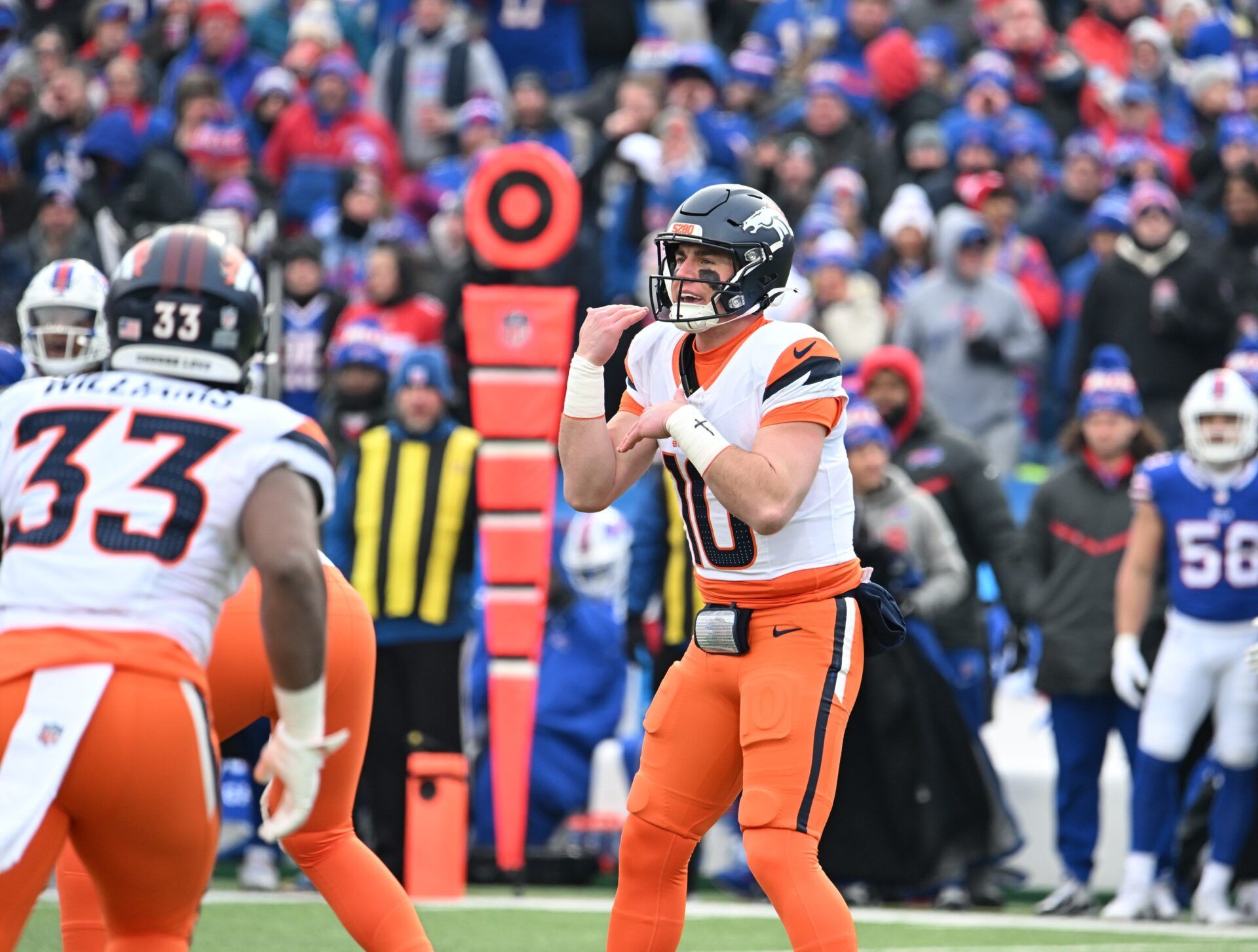 Denver Broncos quarterback Bo Nix (10) signals a play during the second quarter against the Buffalo Bills in an AFC wild card game at Highmark Stadium.