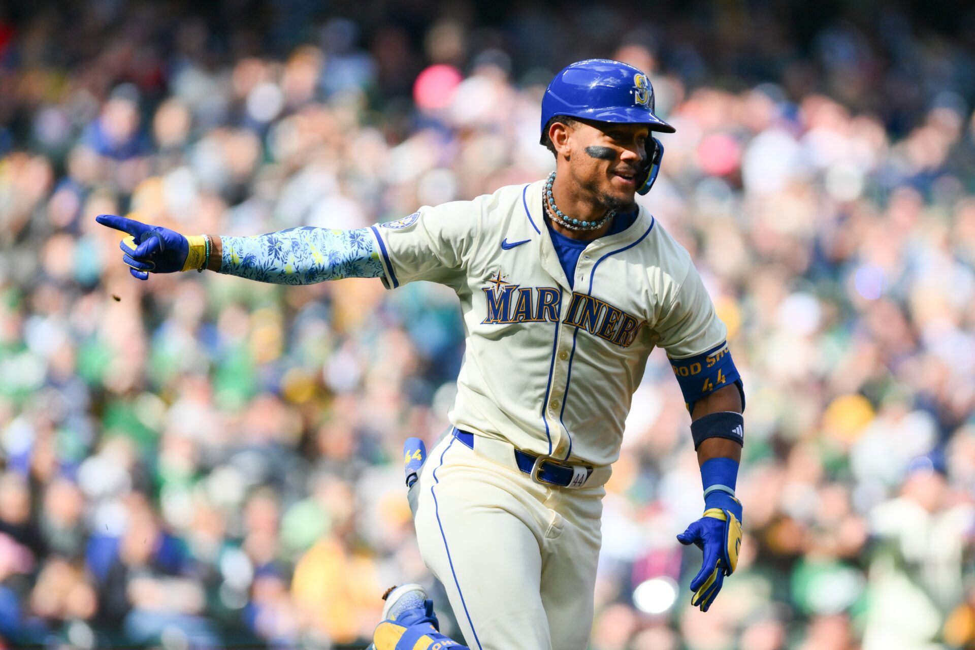 Seattle Mariners center fielder Julio Rodriguez (44) celebrates after hitting an RBI single against the Oakland Athletics during the fifth inning at T-Mobile Park.