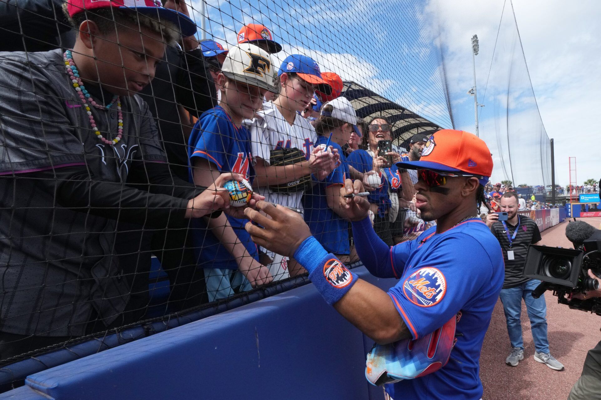 New York Mets shortstop Francisco Lindor (12) signs autographs before the game against the Houston Astros at Clover Park.