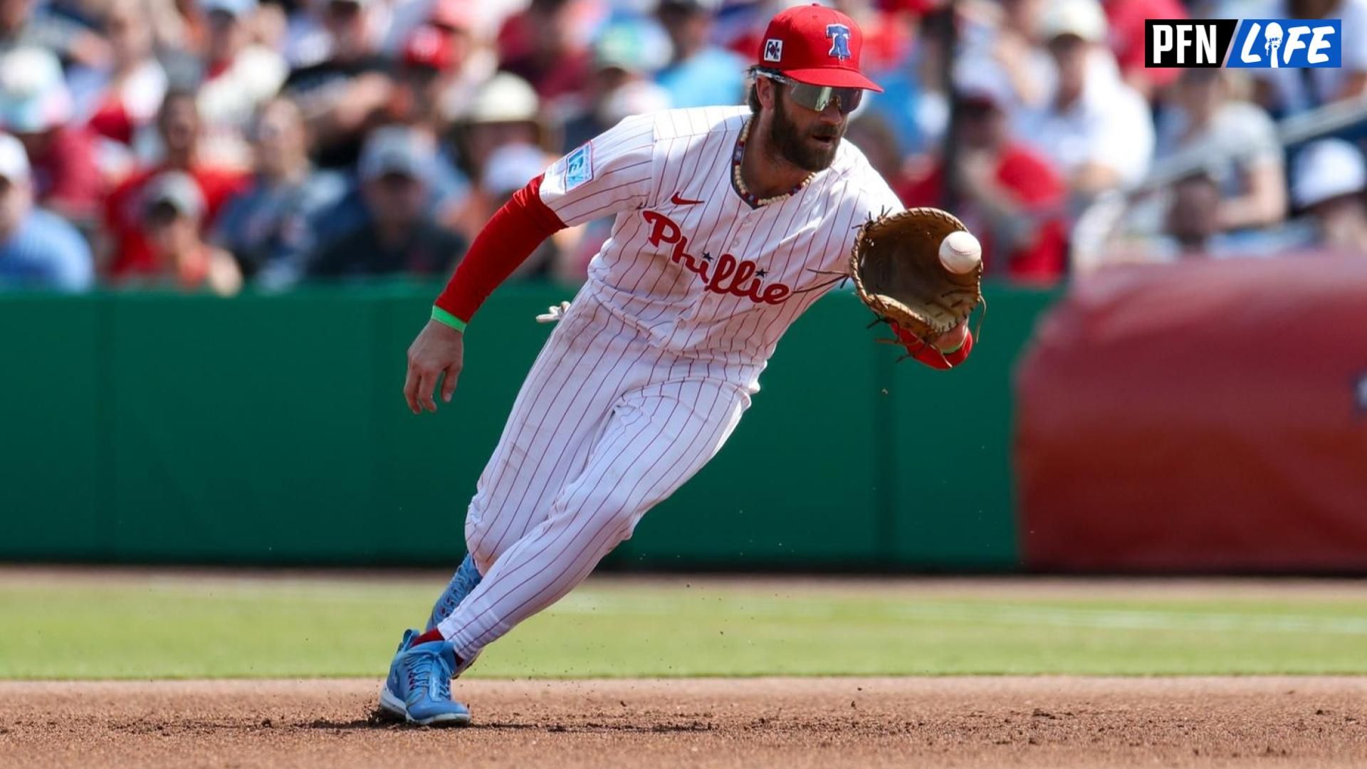 Philadelphia Phillies first baseman Bryce Harper (3) fields the ball against the Baltimore Orioles in the fifth inning during spring trining at BayCare Ballpark.