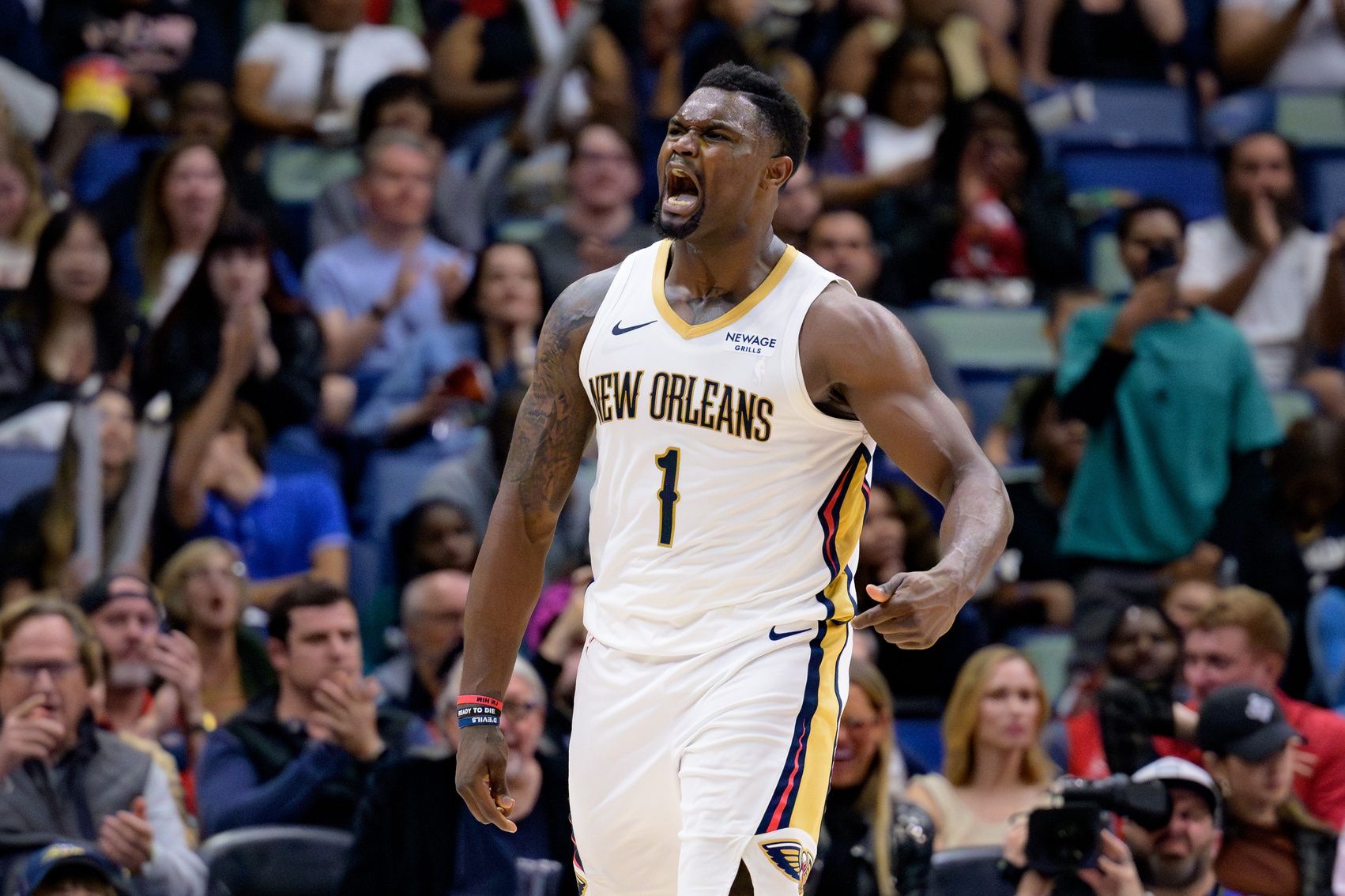 New Orleans Pelicans forward Zion Williamson (1) reacts after a dunk against the Los Angeles Clippers during the fourth quarter at Smoothie King Center.