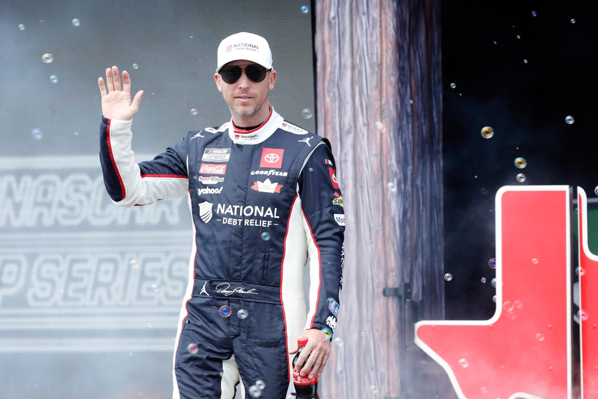 NASCAR Cup Series driver Denny Hamlin (11) walks out onto the stage for driver introductions before the EchoPark Automotive Grand Prix at Circuit of the Americas.