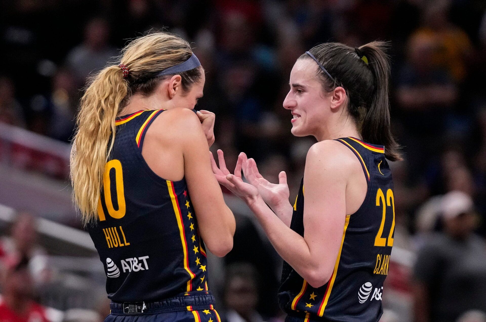 Indiana Fever guard Caitlin Clark (22) and Indiana Fever guard Lexie Hull (10) talk during a timeout on Sunday, Sept. 15, 2024, during the game at Gainbridge Fieldhouse in Indianapolis. The Indiana Fever defeated the Dallas Wings, 110-109.