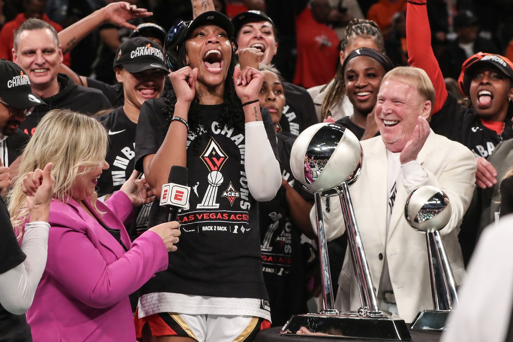 Las Vegas Aces forward A'ja Wilson (22) and owner Mark Davis celebrate after winning the 2023 WNBA Finals at Barclays Center.