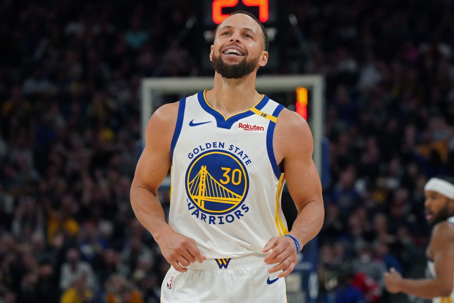 Golden State Warriors guard Stephen Curry (30) smiles during a game against the Detroit Pistons in the fourth quarter at Chase Center.