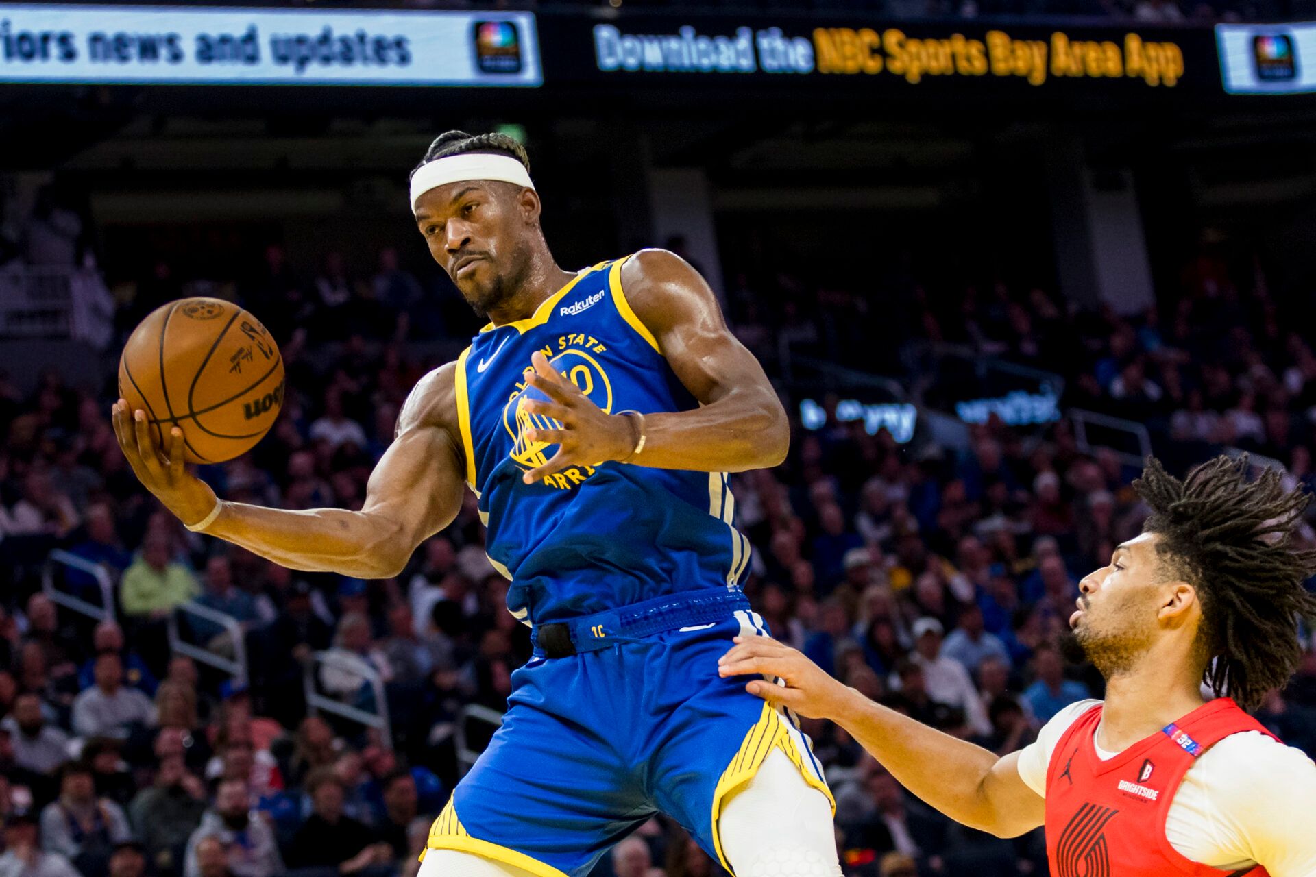 Mar 10, 2025; San Francisco, California, USA; Golden State Warriors forward Jimmy Butler III (10) catches a pass over Portland Trail Blazers guard Shaedon Sharpe (17) during the second quarter at Chase Center. Mandatory Credit: John Hefti-Imagn Images