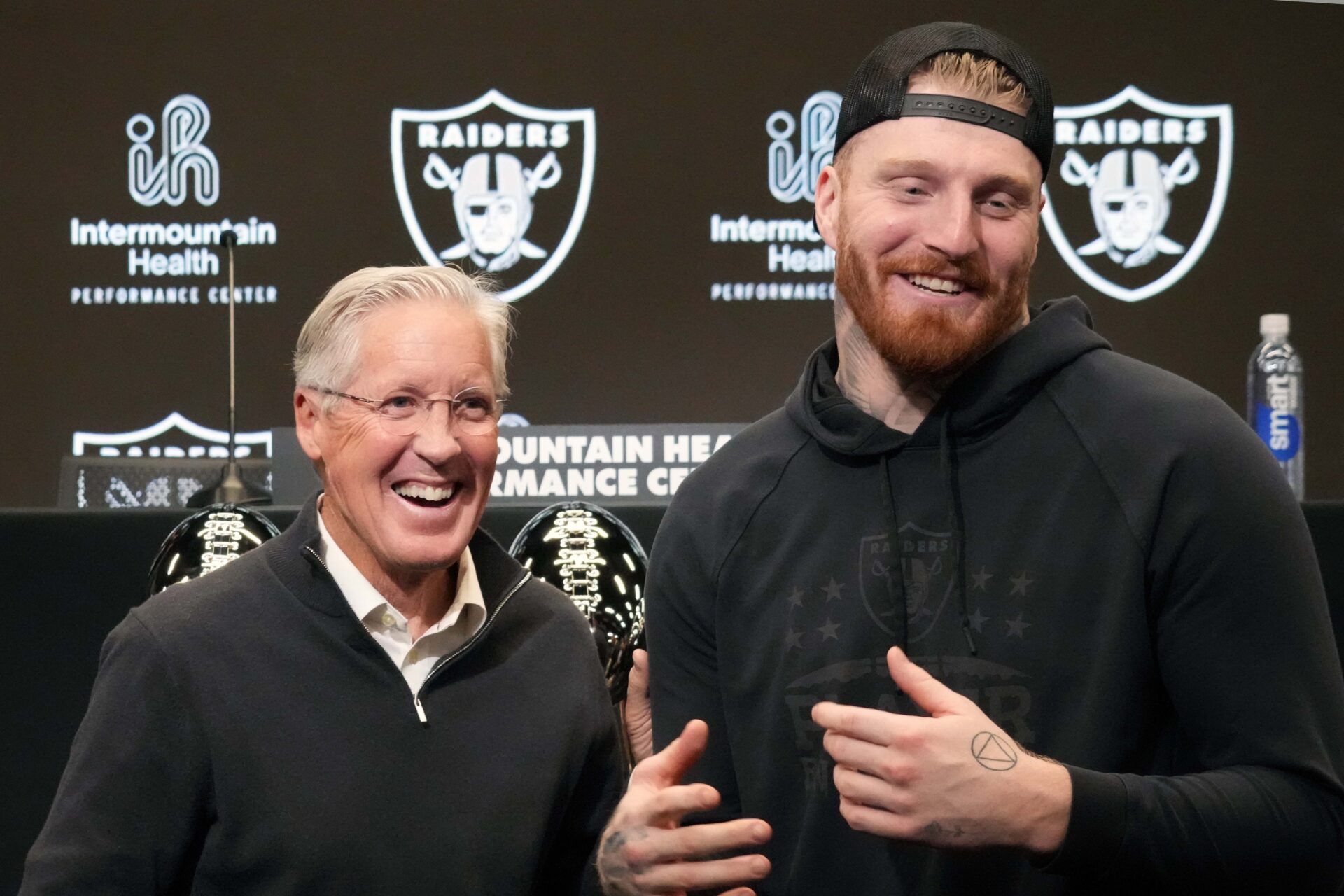 Las Vegas Raiders defensive end Maxx Crosby (right) and coach Pete Carroll at press conference at Intermountain Health Performance Center.