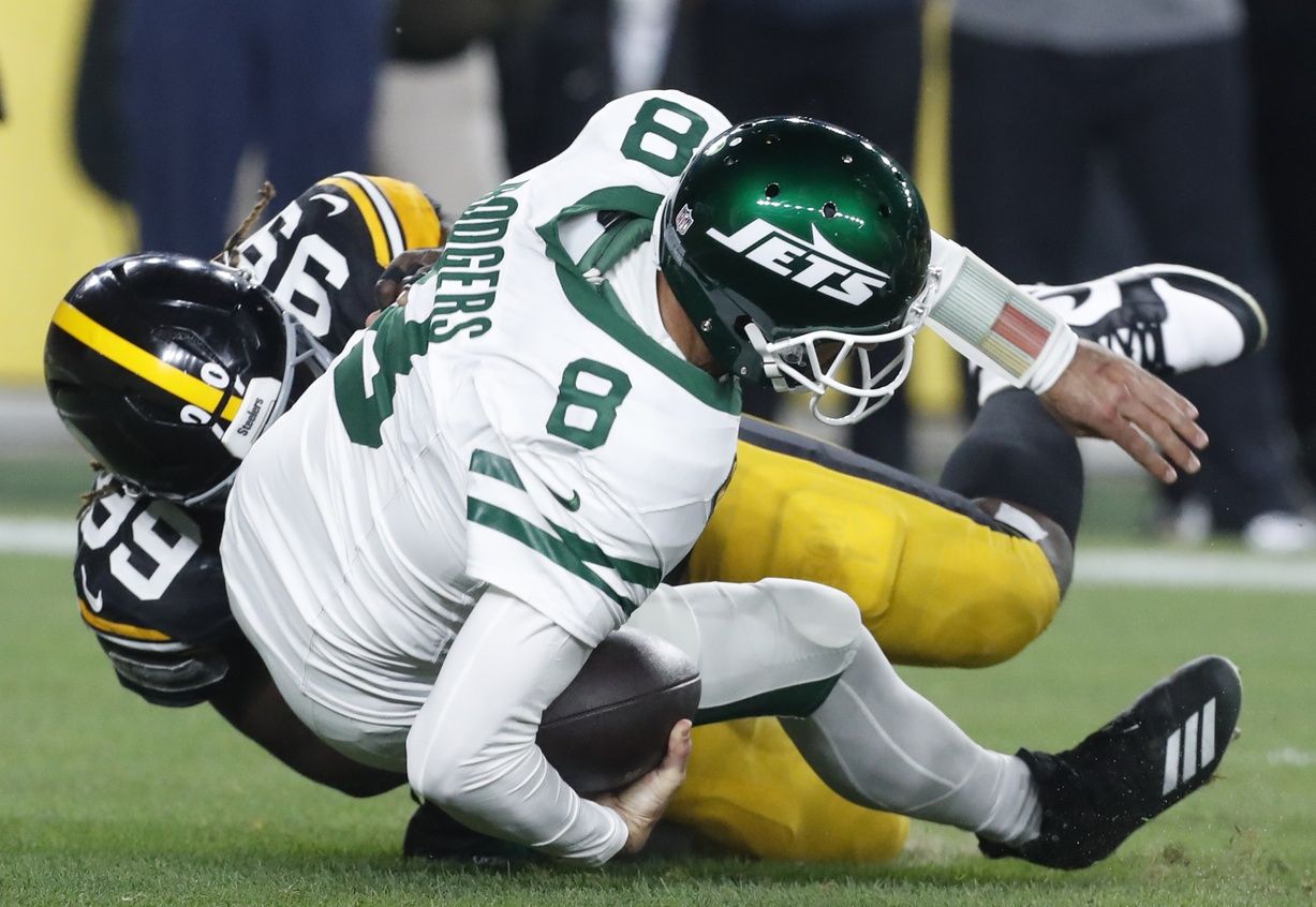 Oct 20, 2024; Pittsburgh, Pennsylvania, USA; Pittsburgh Steelers defensive tackle Larry Ogunjobi (99) sacks New York Jets quarterback Aaron Rodgers (8) during the first quarter at Acrisure Stadium. Mandatory Credit: Charles LeClaire-Imagn Images