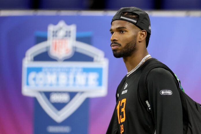 INDIANAPOLIS, INDIANA - MARCH 01: Shedeur Sanders #QB13 of Colorado looks on during the NFL Scouting Combine at Lucas Oil Stadium on March 01, 2025 in Indianapolis, Indiana. (Photo by Stacy Revere/Getty Images)