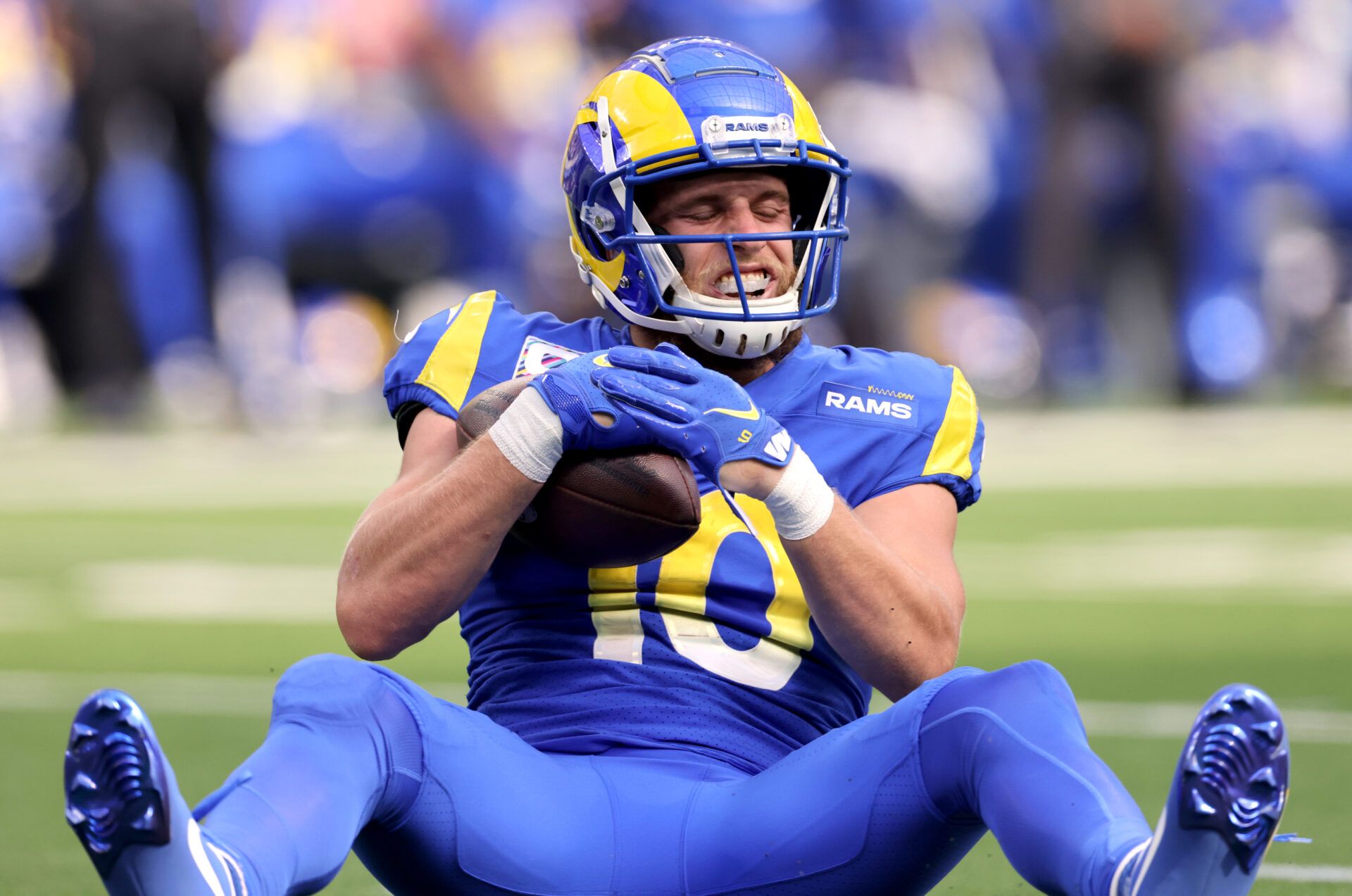 INGLEWOOD, CALIFORNIA - OCTOBER 03: Cooper Kupp #10 of the Los Angeles Rams reacts after being hit after a first down catch in the second quarter against the Arizona Cardinals at SoFi Stadium on October 03, 2021 in Inglewood, California. (Photo by Harry How/Getty Images)