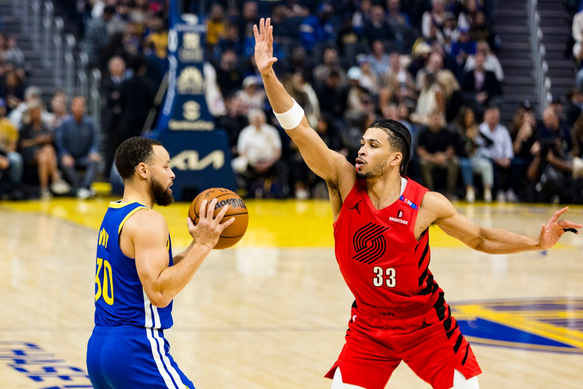 Mar 10, 2025; San Francisco, California, USA; Portland Trail Blazers forward Toumani Camara (33) defends against Golden State Warriors guard Stephen Curry (30) during the first quarter at Chase Center. Mandatory Credit: John Hefti-Imagn Images