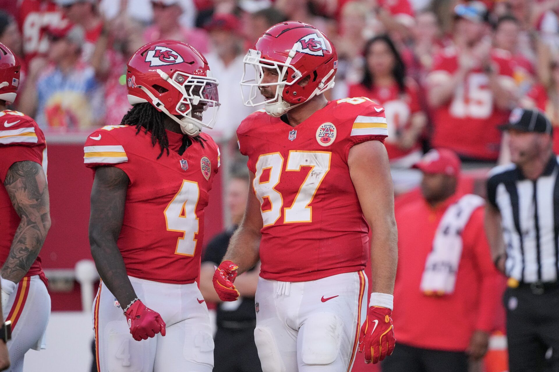 Kansas City Chiefs tight end Travis Kelce (87) celebrates with wide receiver Rashee Rice (4) after a play against the Cincinnati Bengals during the game at GEHA Field at Arrowhead Stadium.