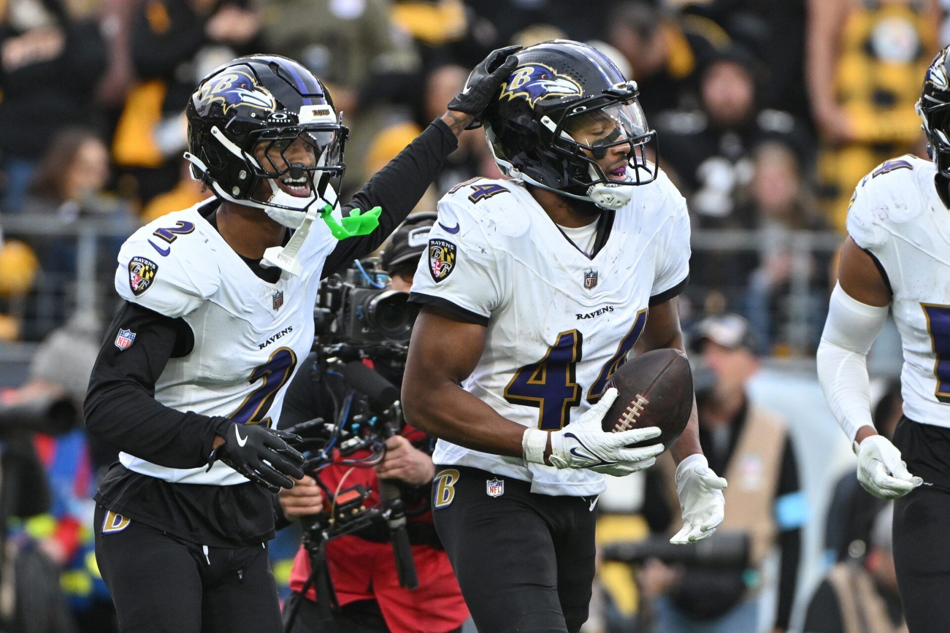 Baltimore Ravens cornerback Marlon Humphrey (44) celebrates with Nate Wiggins (2) after ntercepting a pass in the end zone against the Pittsburgh Steelers during the fourth quarter at Acrisure Stadium.