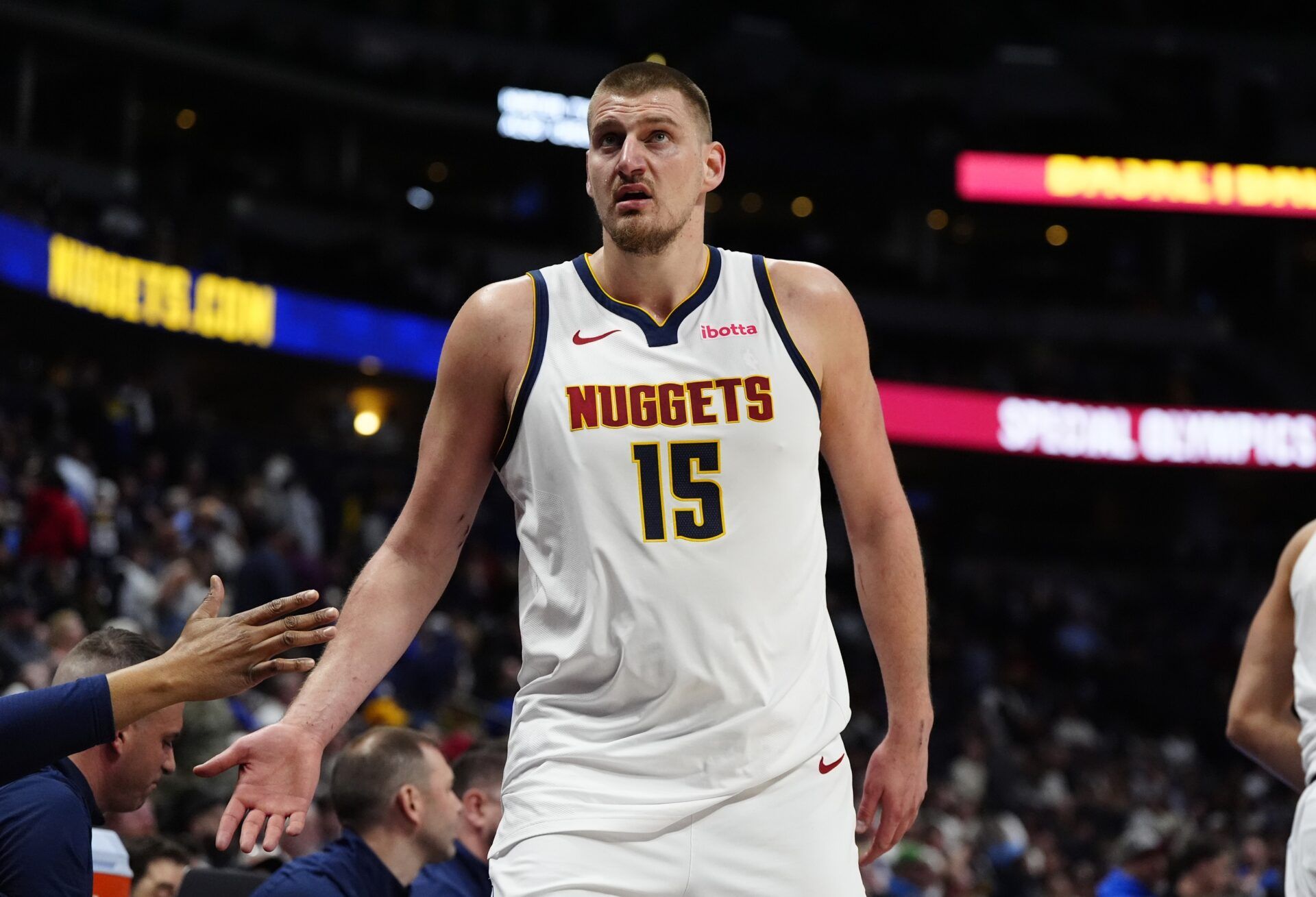 Denver Nuggets center Nikola Jokic (15) heads to the bench in the fourth quarter against the Minnesota Timberwolves at Ball Arena.