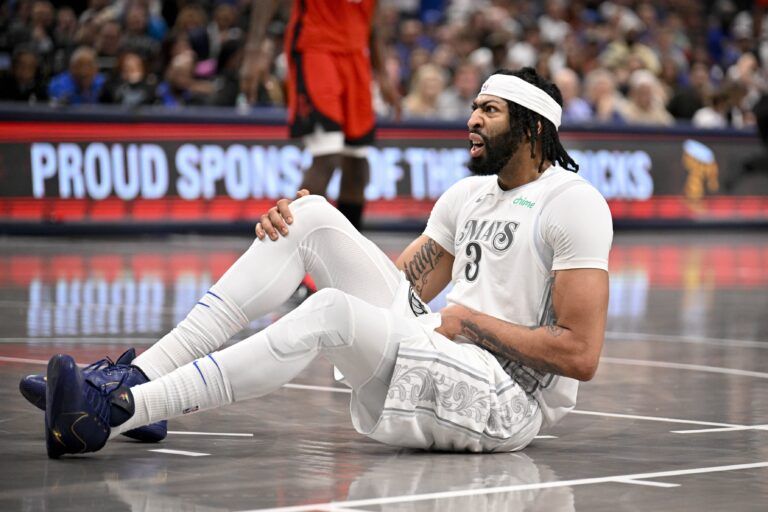 Dallas Mavericks forward Anthony Davis (3) grabs his midsection with an apparent injury during the game between the Dallas Mavericks and the Houston Rockets at the American Airlines Center.