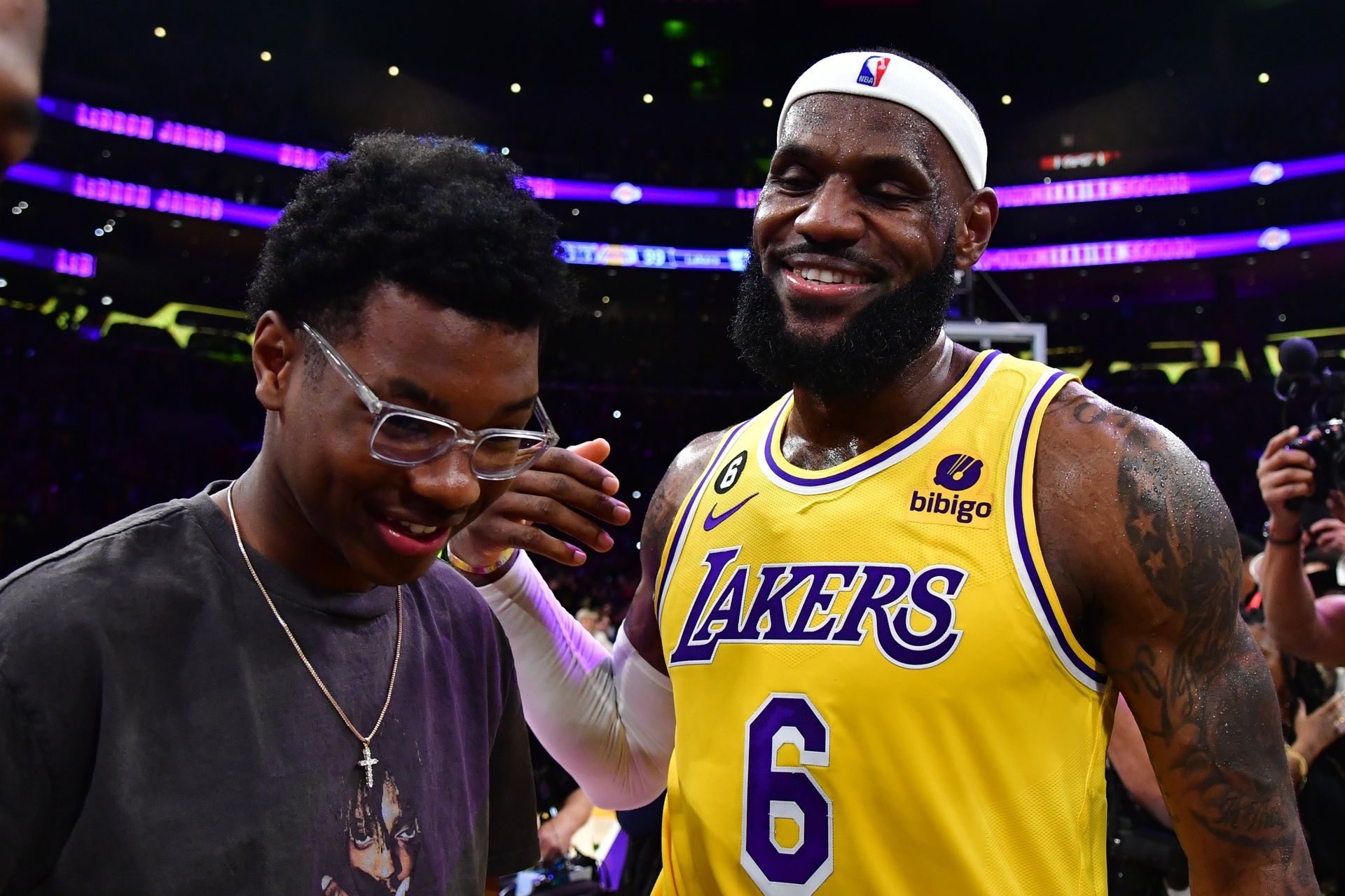 Los Angeles Lakers forward LeBron James (6) celebrates with his son Bryce Maximus after breaking the all-time scoring record in the third quarter against the Oklahoma City Thunder at Crypto.com Arena.