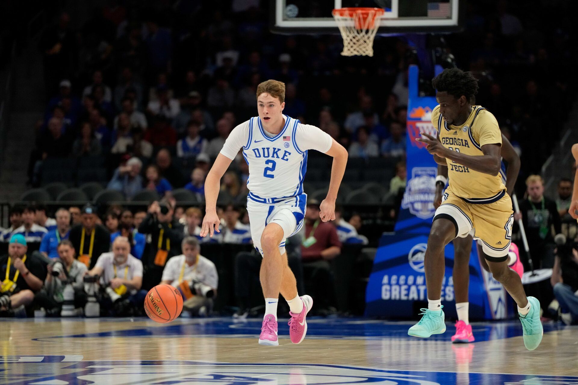 Duke Blue Devils forward Cooper Flagg (2) on the fast break as Georgia Tech Yellow Jackets forward Baye Ndongo (11) defends in the first half at Spectrum Center.