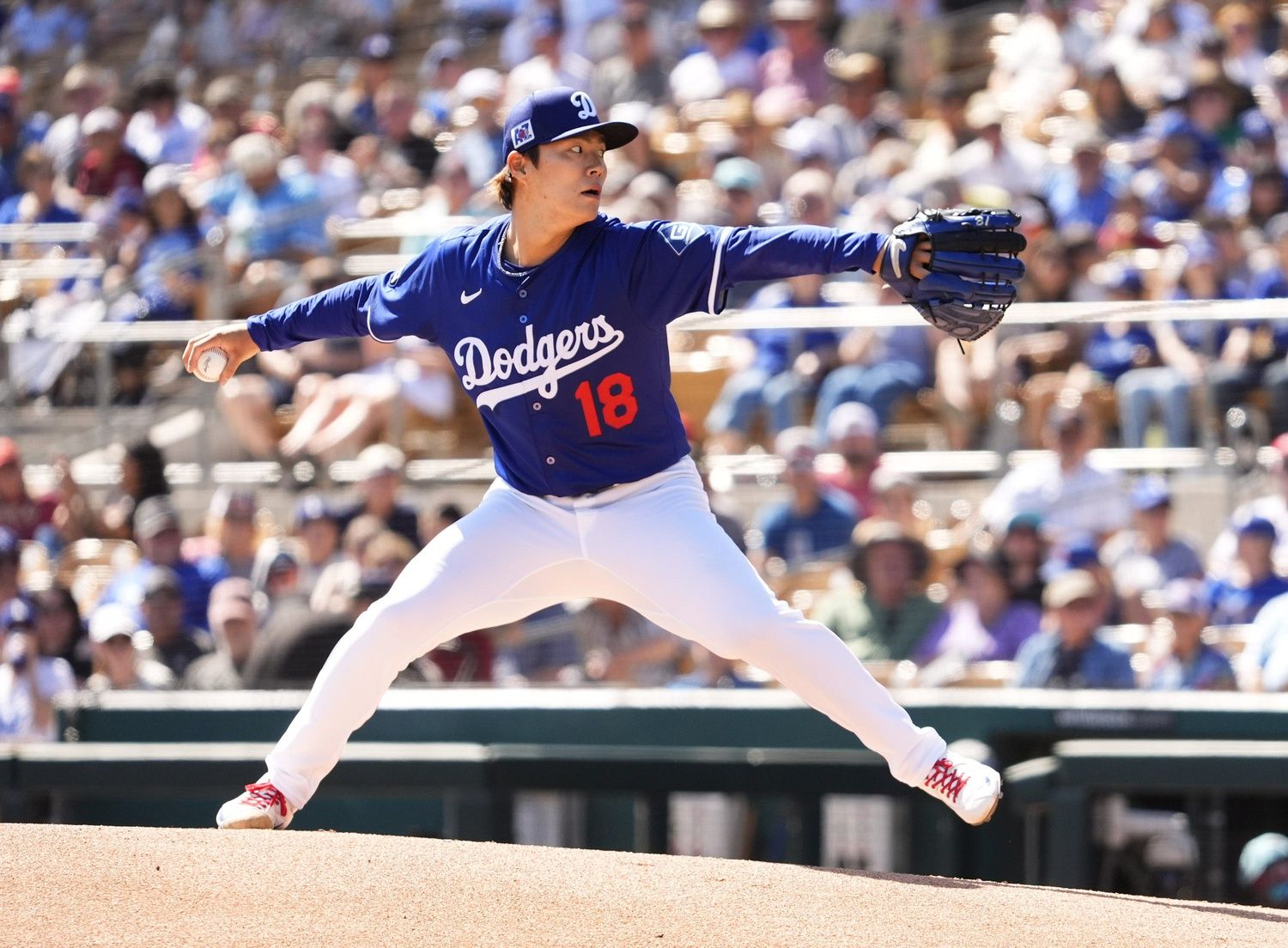 Los Angeles Dodgers pitcher Yoshinobu Yamamoto throws to the Arizona Diamondbacks in the first inning during a spring training game at Camelback Ranch-Glendale in Phoenix on March 10, 2025.