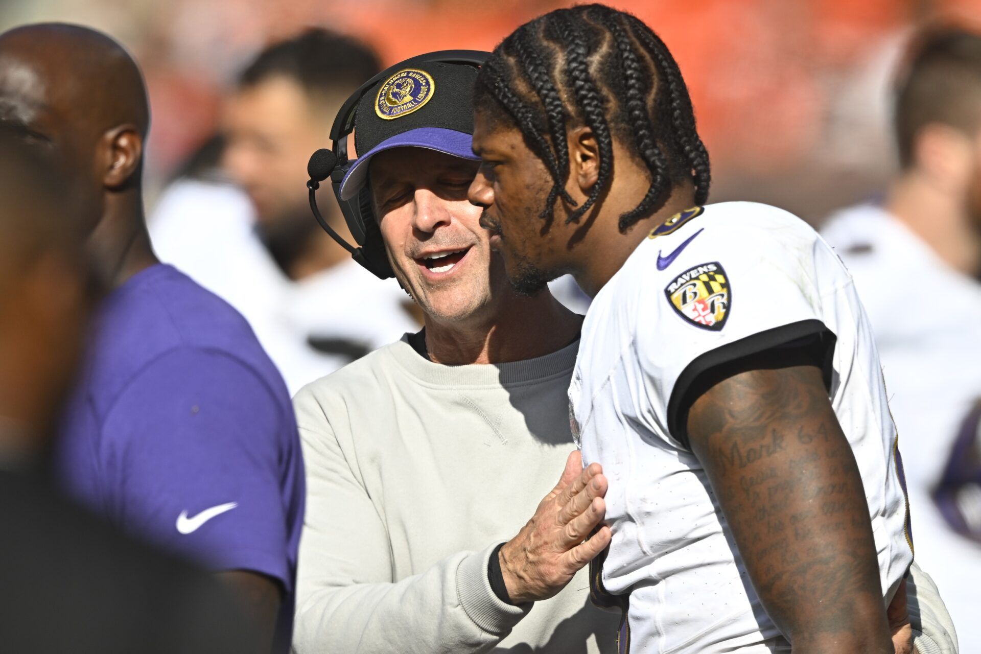 Baltimore Ravens head coach John Harbaugh talks with quarterback Lamar Jackson (8) in the fourth quarter against the Cleveland Browns at Cleveland Browns Stadium.