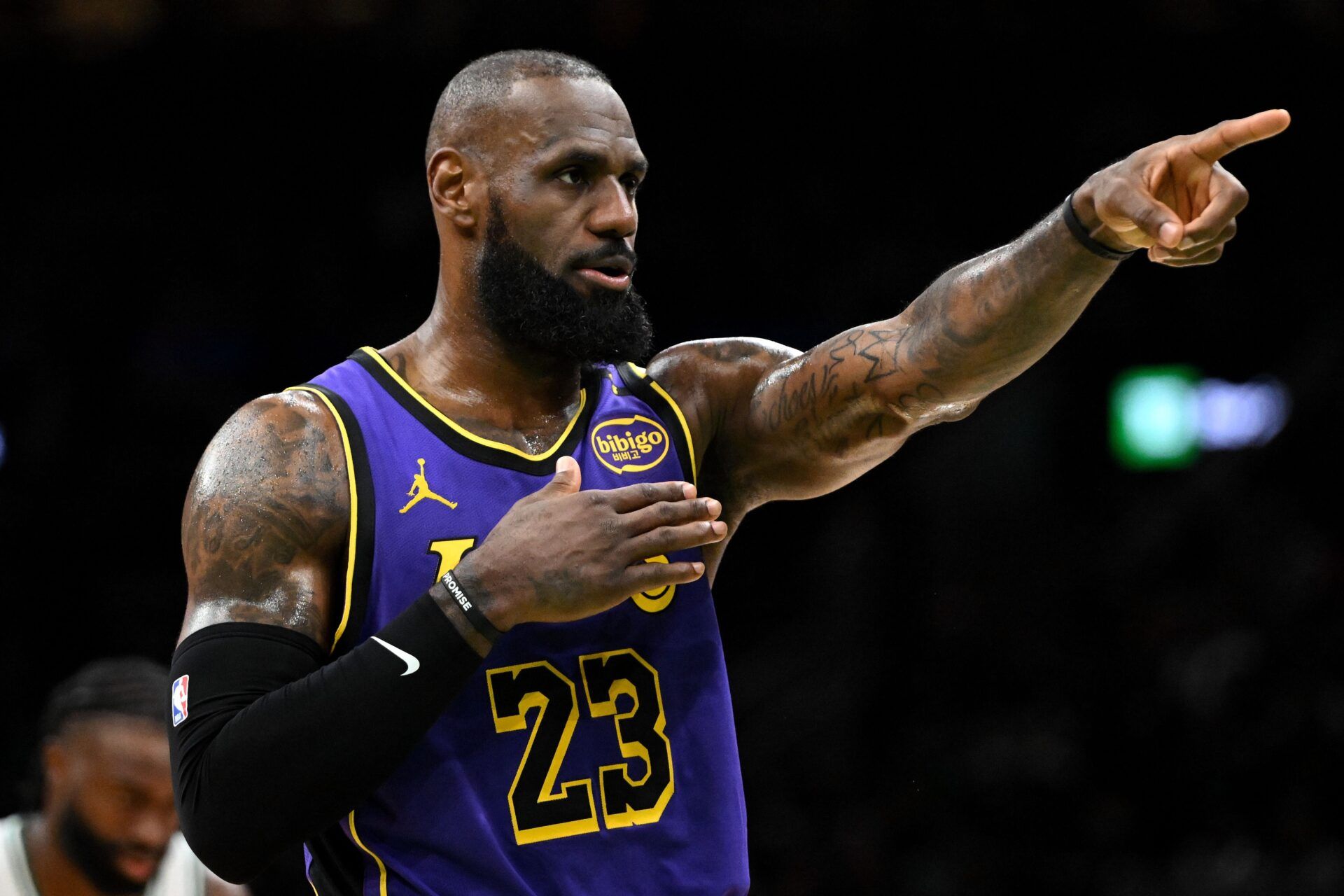 Los Angeles Lakers forward LeBron James (23) calls a play against the Boston Celtics during the second quarter at the TD Garden.