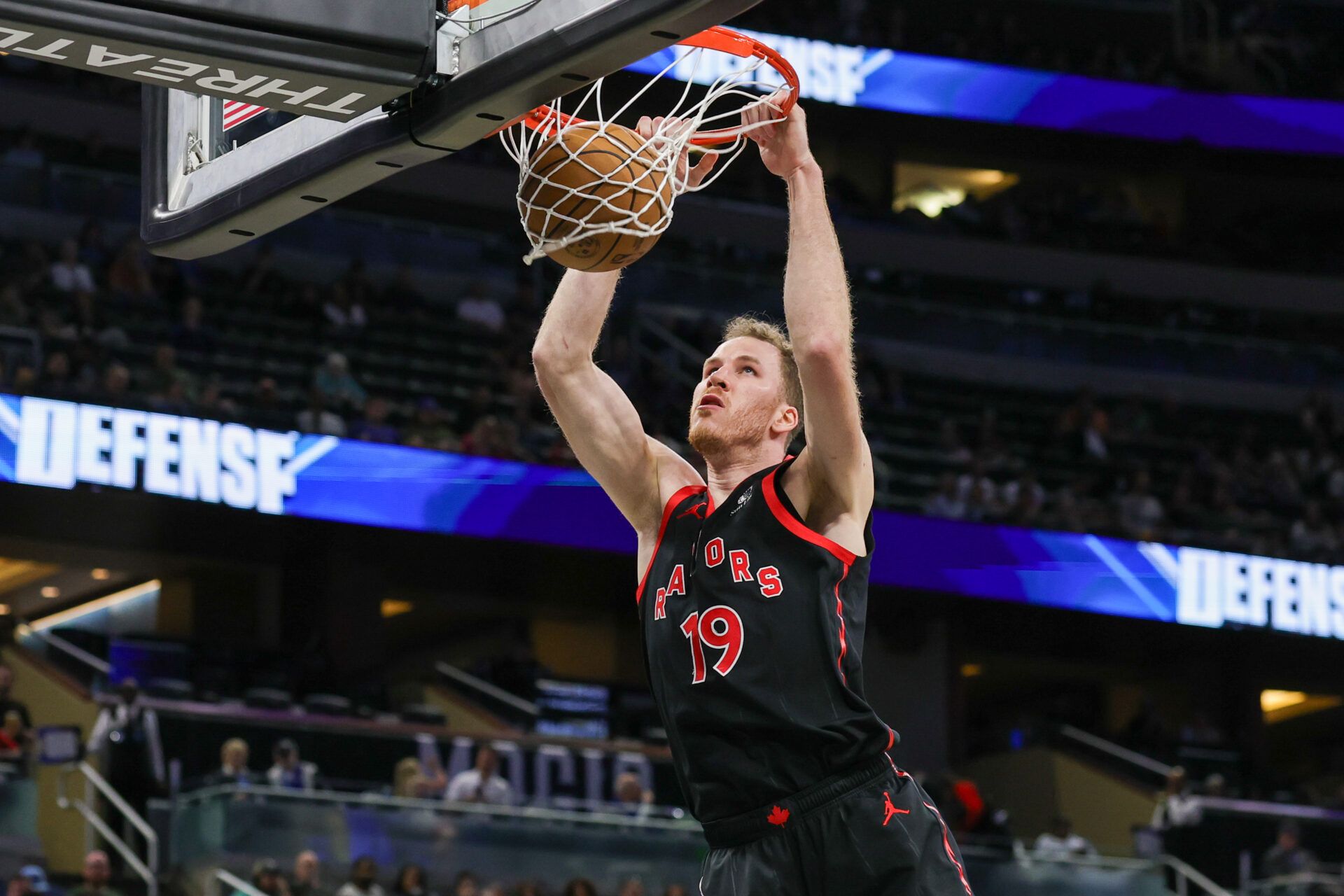 Toronto Raptors center Jakob Poeltl (19) dunks during the second half against the Orlando Magic at Kia Center. Mandatory Credit: Mike Watters-Imagn Images