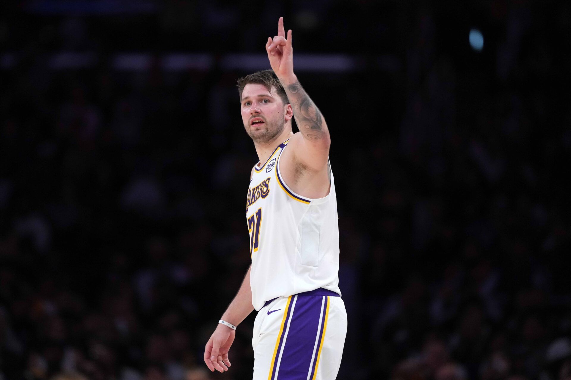 Mar 16, 2025; Los Angeles, California, USA; Los Angeles Lakers guard Luka Doncic (77) reacts against the Phoenix Suns in the second half at Crypto.com Arena. Mandatory Credit: Kirby Lee-Imagn Images