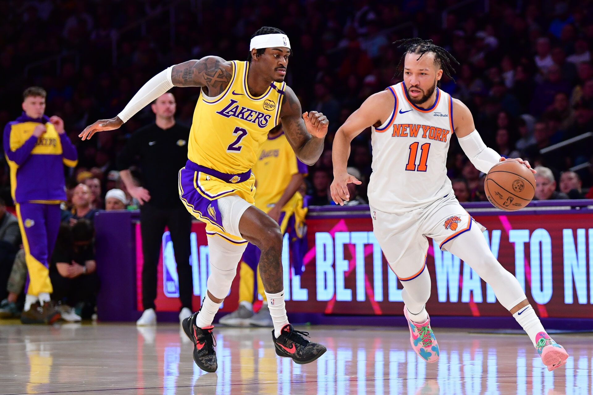 Mar 6, 2025; Los Angeles, California, USA; New York Knicks guard Jalen Brunson (11) moves the ball against Los Angeles Lakers forward Jarred Vanderbilt (2) during the first half at Crypto.com Arena. Mandatory Credit: Gary A. Vasquez-Imagn Images