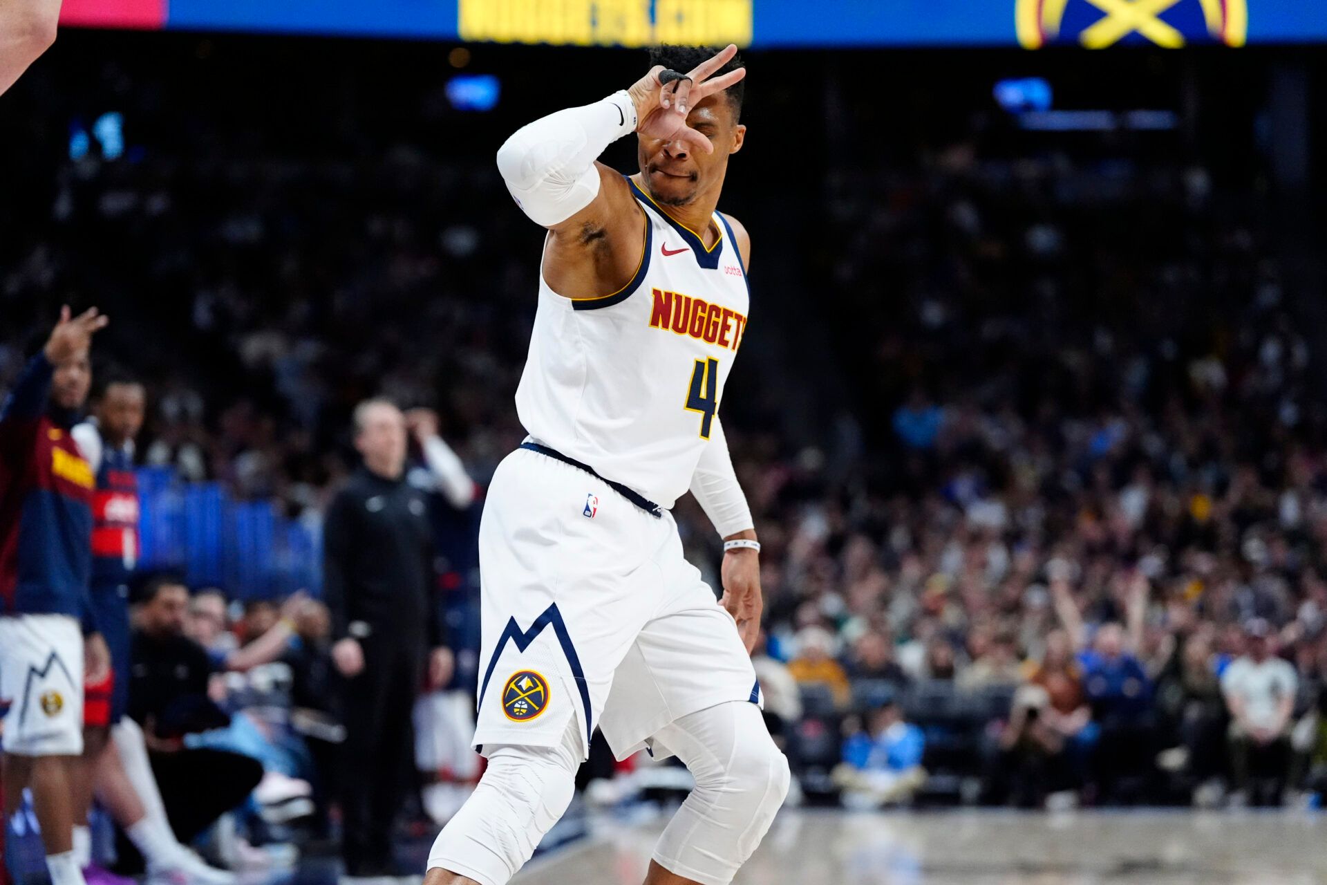 Mar 15, 2025; Denver, Colorado, USA; Denver Nuggets guard Russell Westbrook (4) celebrates a successful three-point score in the first quarter against the Washington Wizards at Ball Arena. Mandatory Credit: Ron Chenoy-Imagn Images