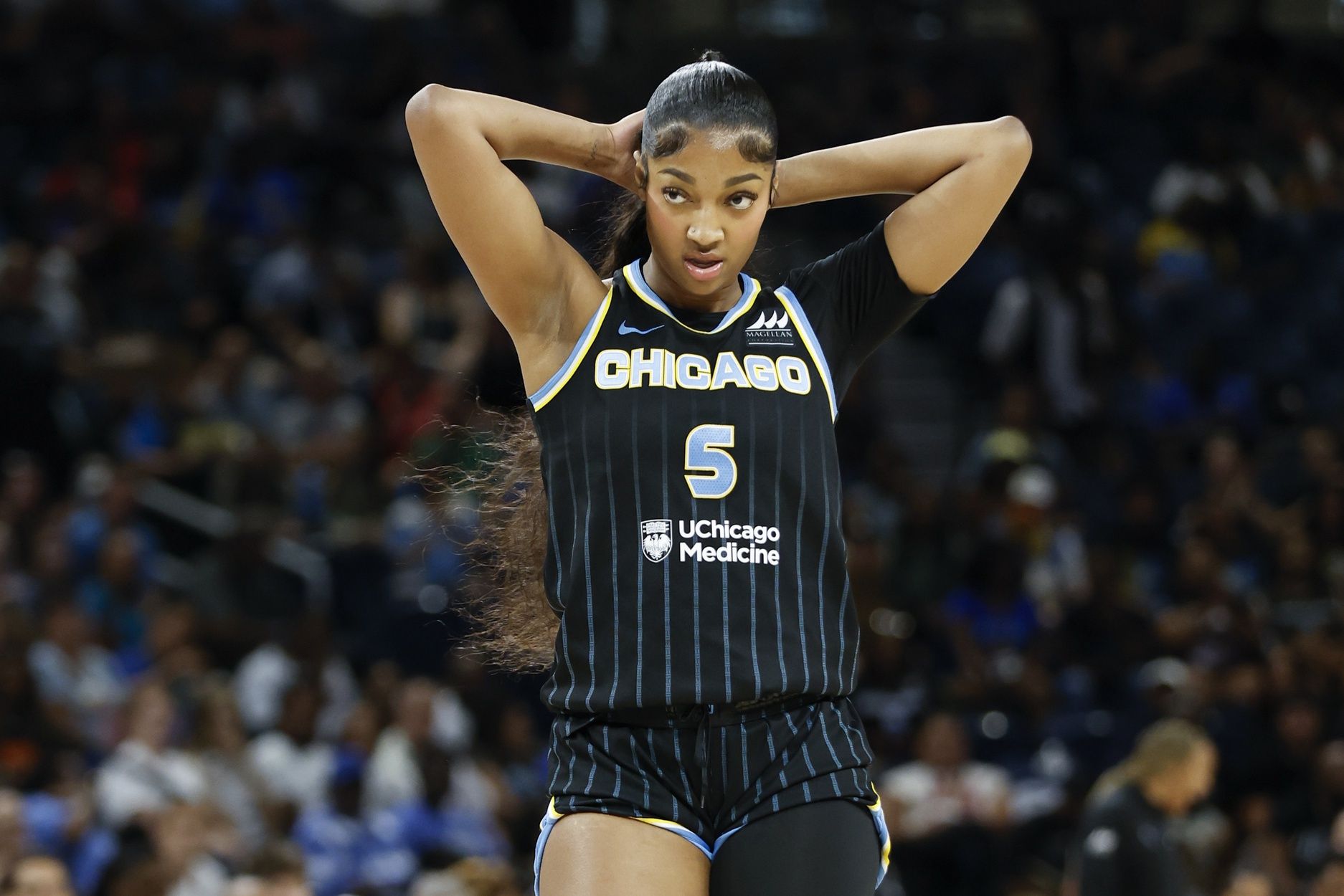 Chicago Sky forward Angel Reese (5) walks on the court during the first half at Wintrust Arena.