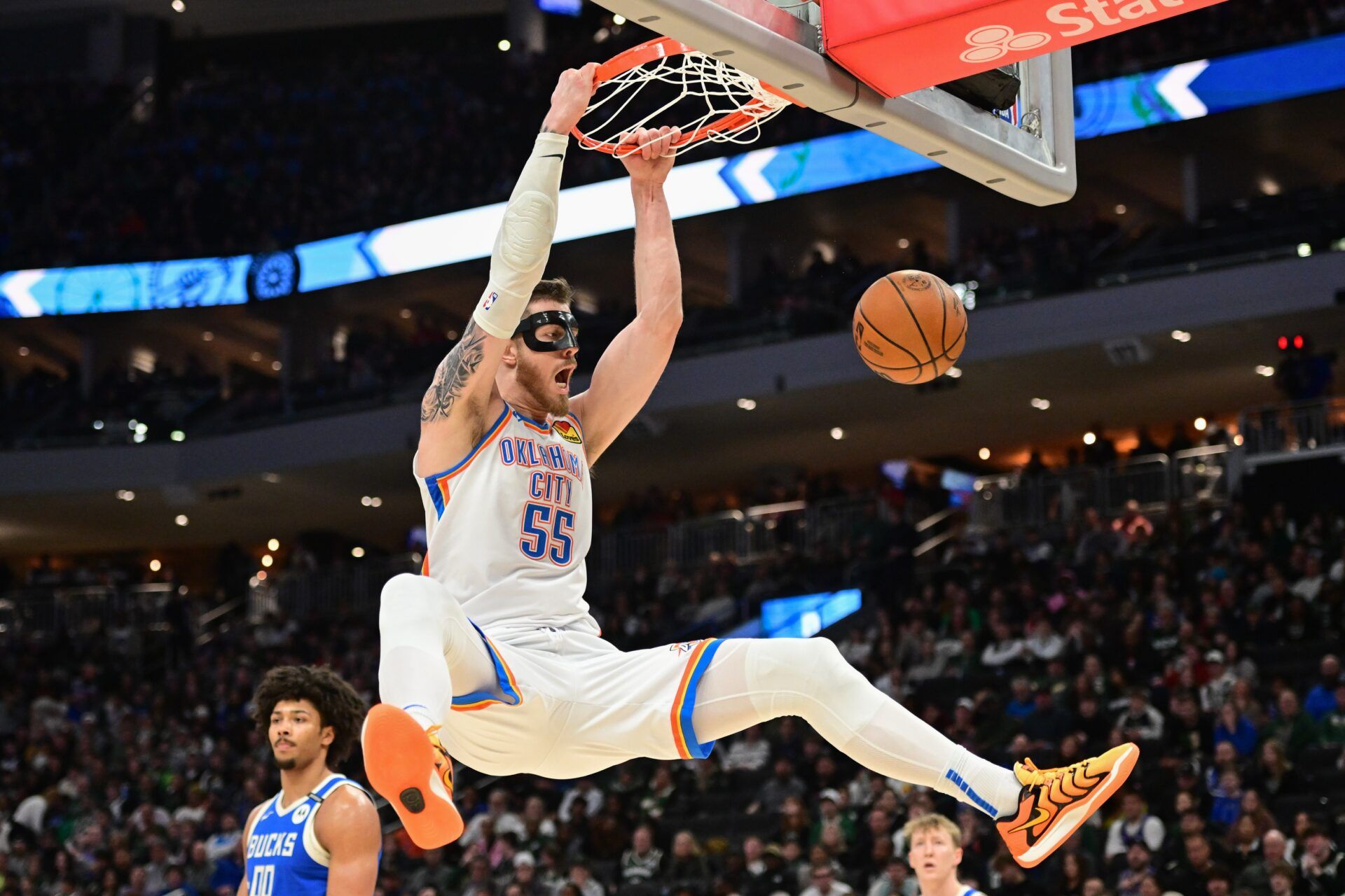 Oklahoma City Thunder center Isaiah Hartenstein (55) dunks the ball in the second quarter against the Milwaukee Bucks at Fiserv Forum.