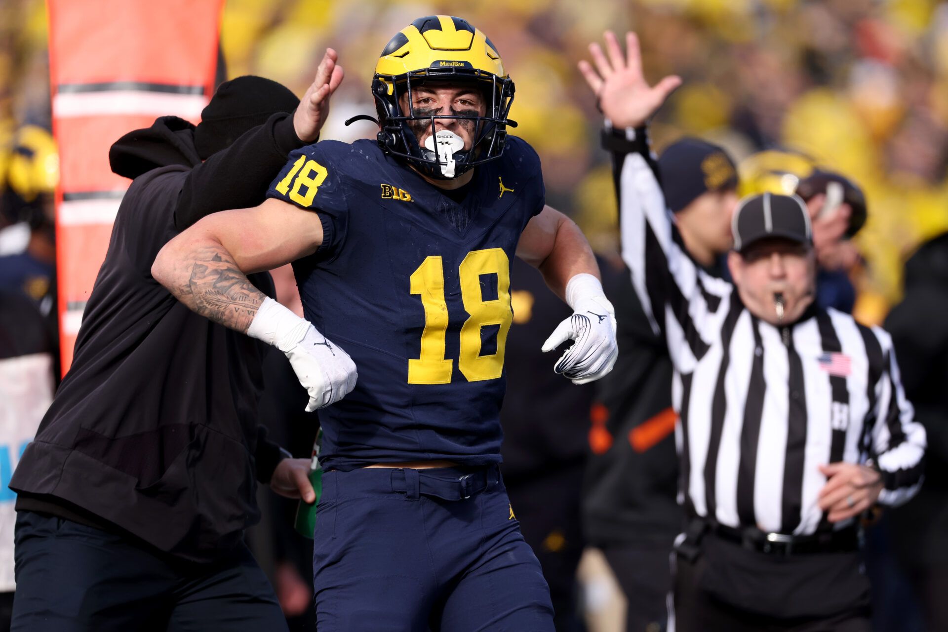 ANN ARBOR, MICHIGAN - NOVEMBER 25: Colston Loveland #18 of the Michigan Wolverines celebrates a first down against the Ohio State Buckeyes during the second quarter in the game at Michigan Stadium on November 25, 2023 in Ann Arbor, Michigan. (Photo by Gregory Shamus/Getty Images)